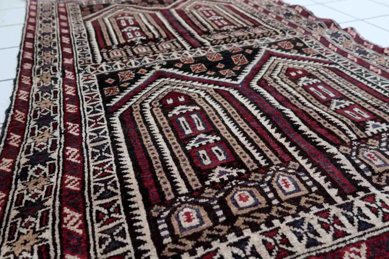 Handmade vintage Afghan Baluch rug in unusual multi-praying design. The rug is from the end of 20th century made in wool.

-condition: original good,

-circa: 1970s,

-size: 3' x 4.6' (95cm x 142cm),
​
-material: wool,

-country of origin: