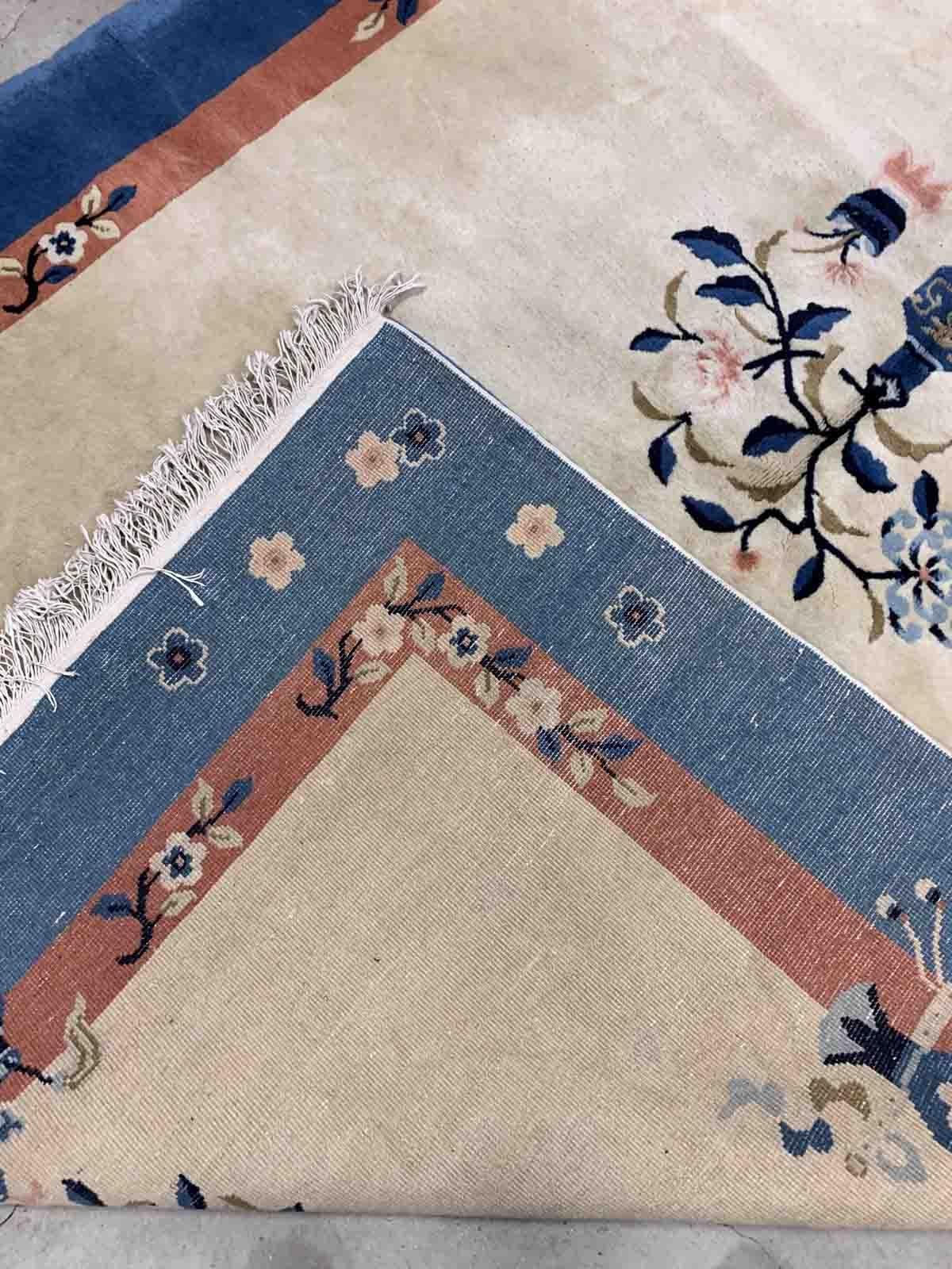 Handmade vintage Art Deco Chinese rug in beige and blue shades. The rug is from the beginning of 20th century in original good condition. 

-condition: original good,

-circa: 1930s,

-size: 5.1' x 8.1' (155cm x 247cm),
?
-material:
