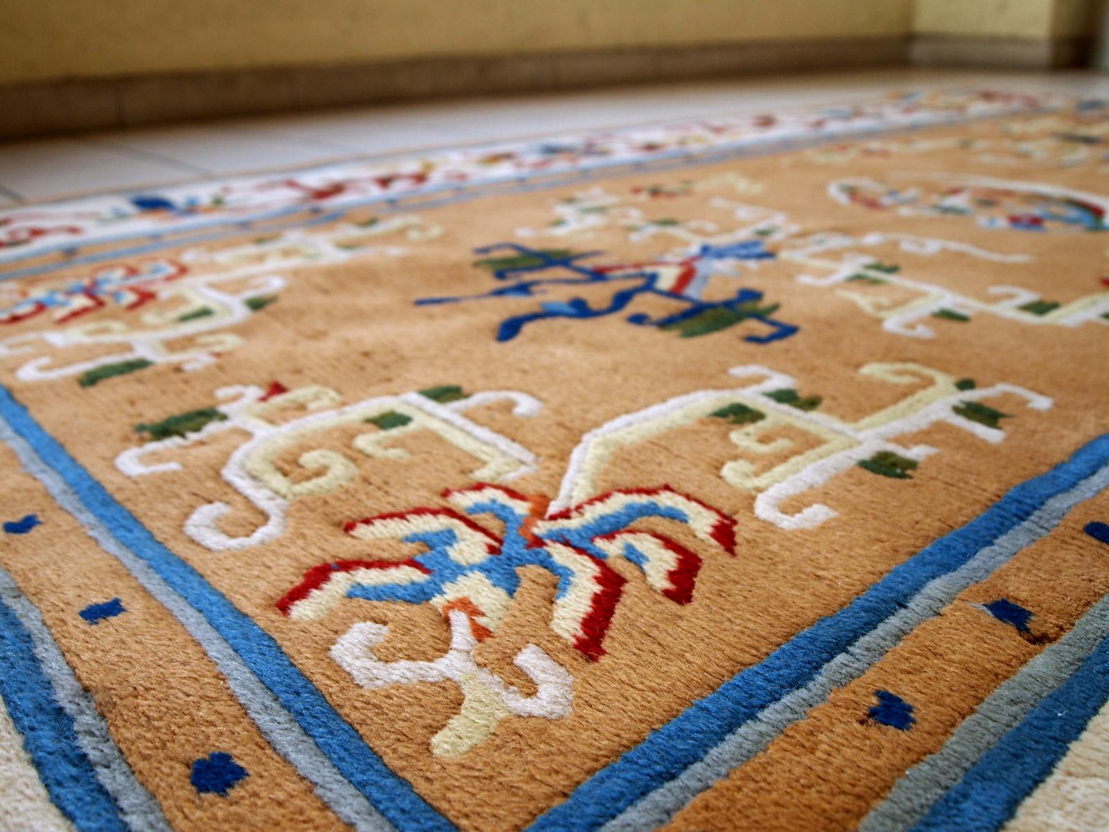Vintage handmade Art Deco Chinese rug in good condition. Beautiful light brown background decorated with abstract design in burgundy and blue shades. 

-Condition: Good,

-circa 1960s,

-Size: 3.9' x 6.9' (120cm x 213cm),

-Material:
