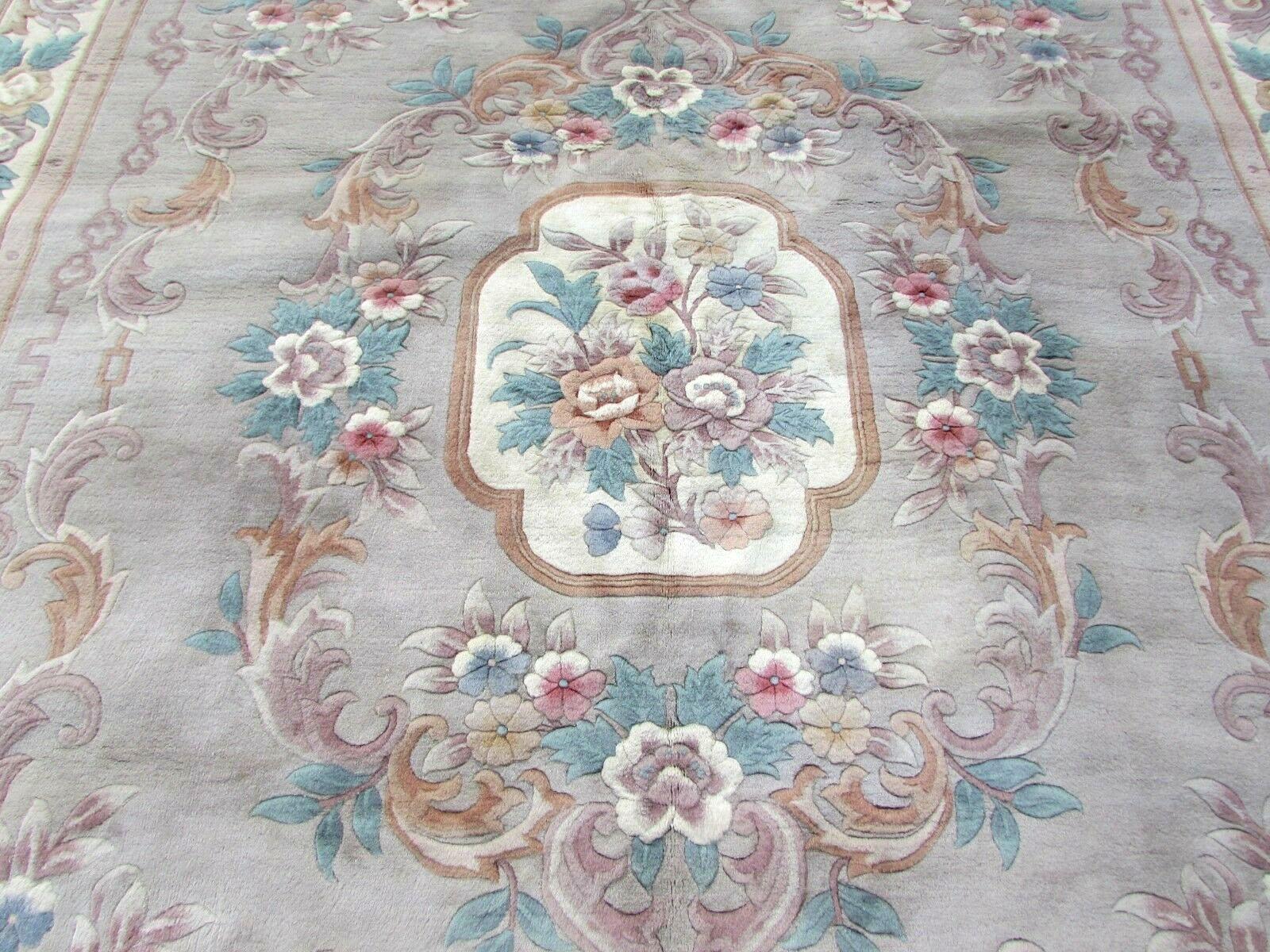 Handmade vintage Chinese rug in French Aubusson style. It is from the end of 20th century in original good condition, it has some age discoloration.

- Condition: Original, age discoloration,

- circa 1970s,

- Size: 9' x 12.3' (270cm x