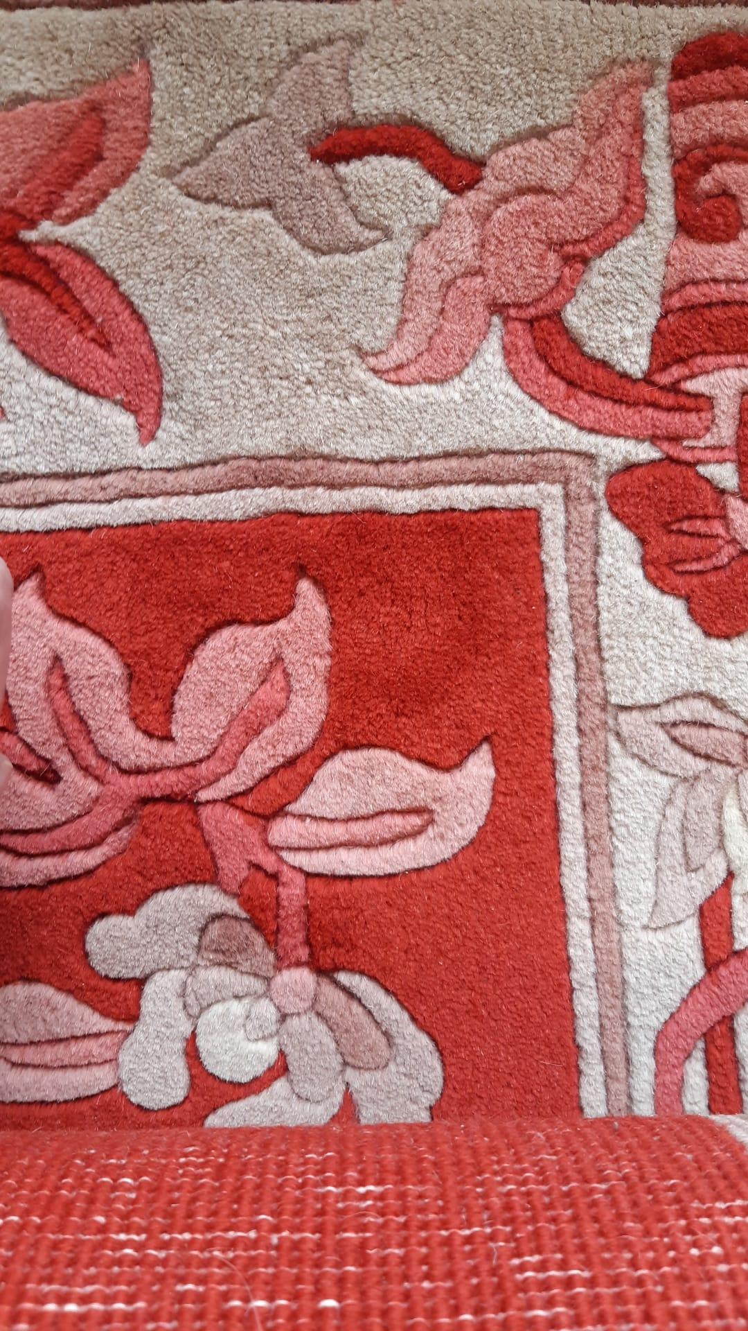 This beautiful vintage Chinese runner rug, handcrafted in the 1970s, showcases an Art Deco aesthetic with vibrant colors and intricate designs. Made from high-quality wool, it features an elongated rectangular shape, perfect for hallways or as a