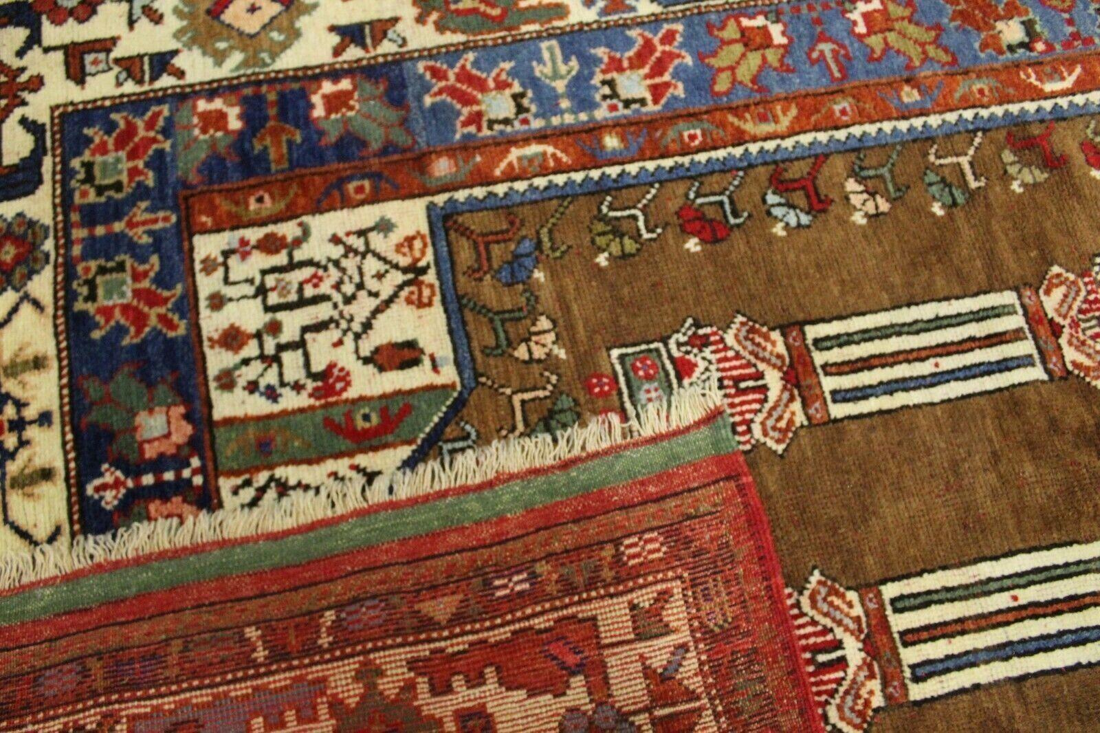 Enrich your home with the cultural richness of this Handmade Vintage Caucasian Kazak Rug from the 1960s. Measuring 4.3' x 5.8', this rug boasts a prayer design and features a palette of natural colors.

Despite its age, it remains in remarkably good