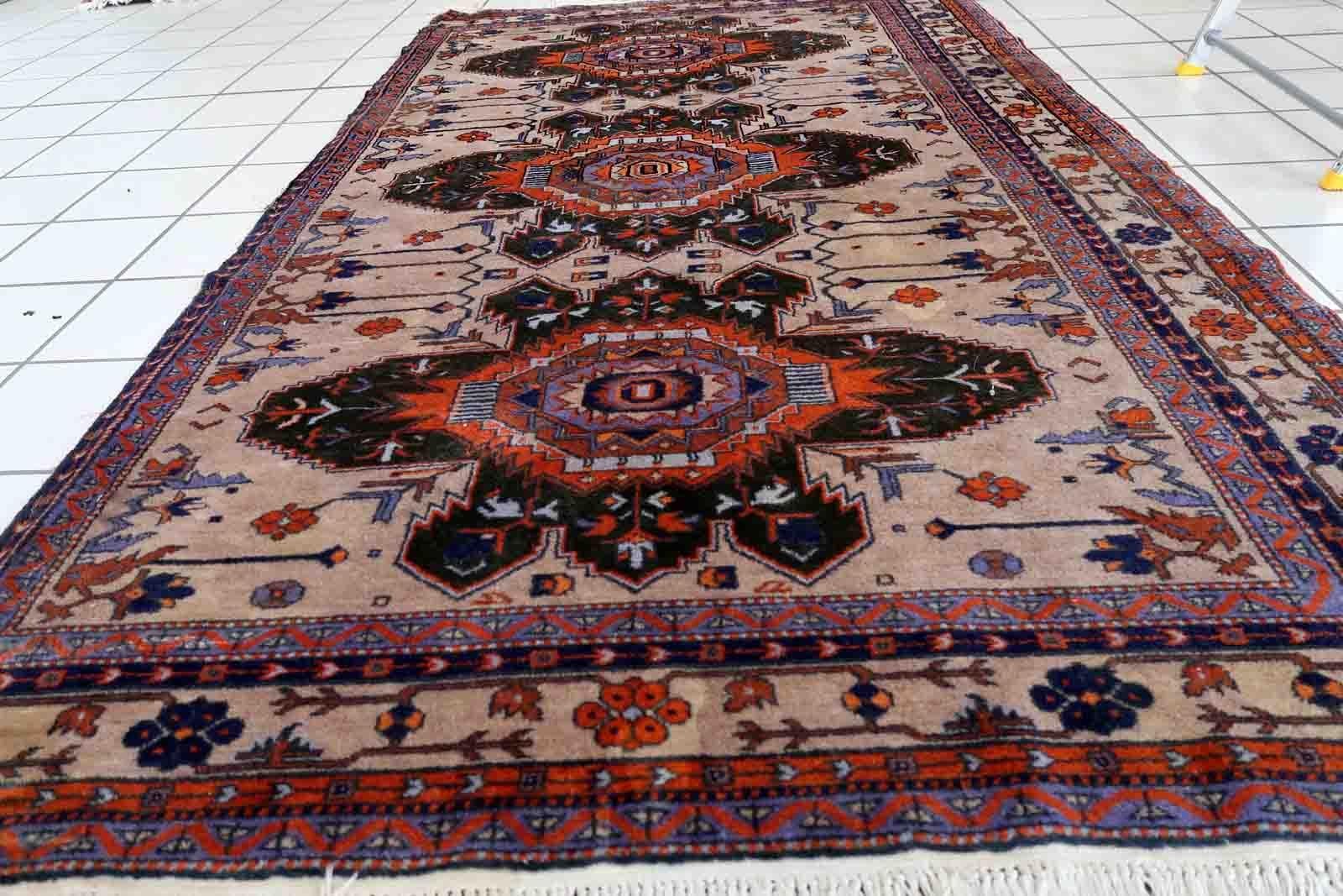 Handmade vintage Caucasian Kazak rug in traditional medallion design. The rug is from the middle of 20th century in original condition, it is missing one side.

-condition: original, missing one side,

-circa: 1960s,

-Size: 4' x 6.9' (123cm x
