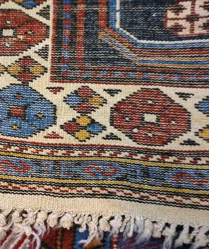 Handmade vintage Caucasian Shirvan rug in unusual cross design. The rug is from the middle of 20th century in original good condition.

-condition: original good,

-circa: 1950s,

-size: 4.3' x 6.8' (132cm x 209cm),

-material: