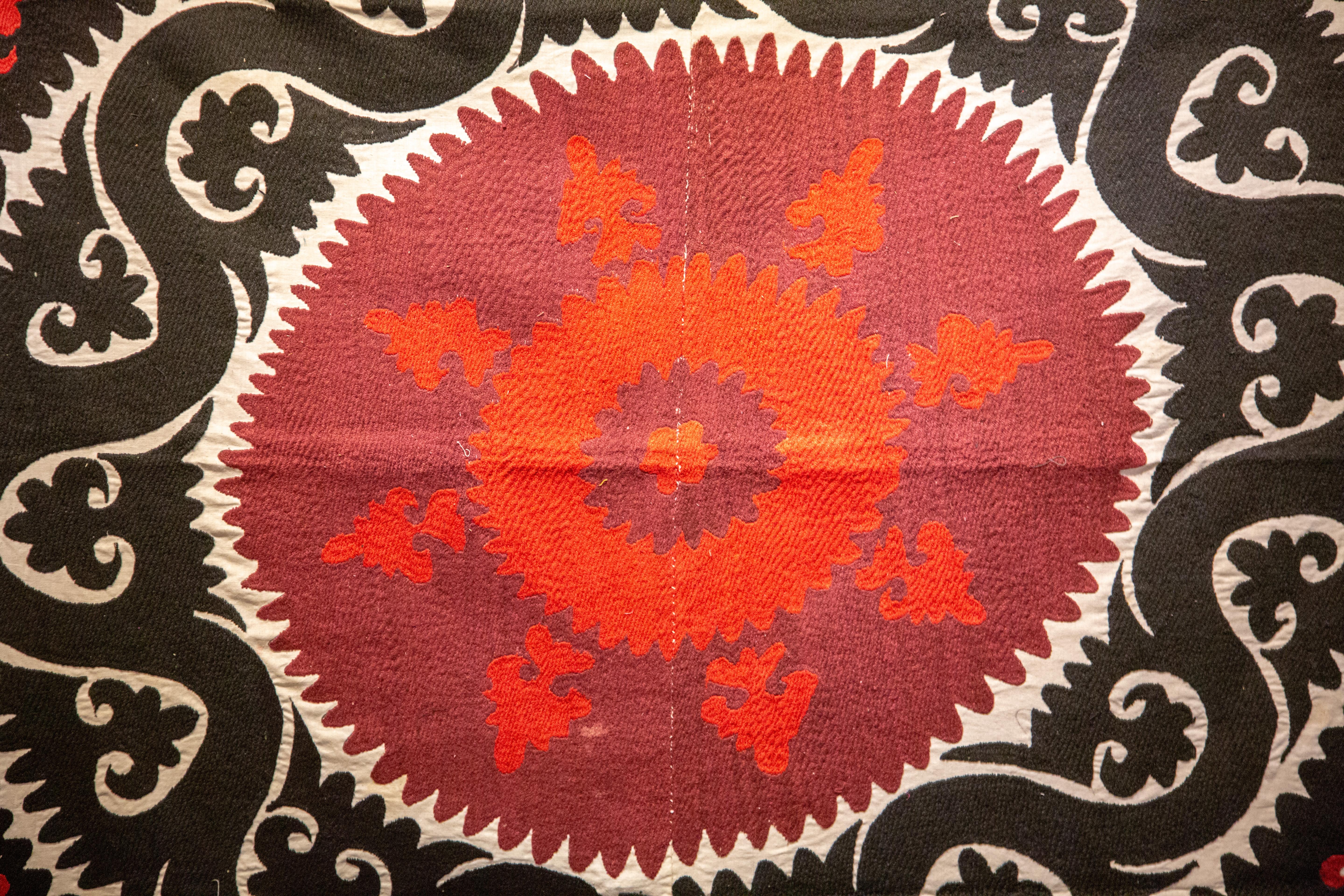 Handmade Vintage Cotton Suzani, Red, and Charcoal geometric designs.

Measures: 59