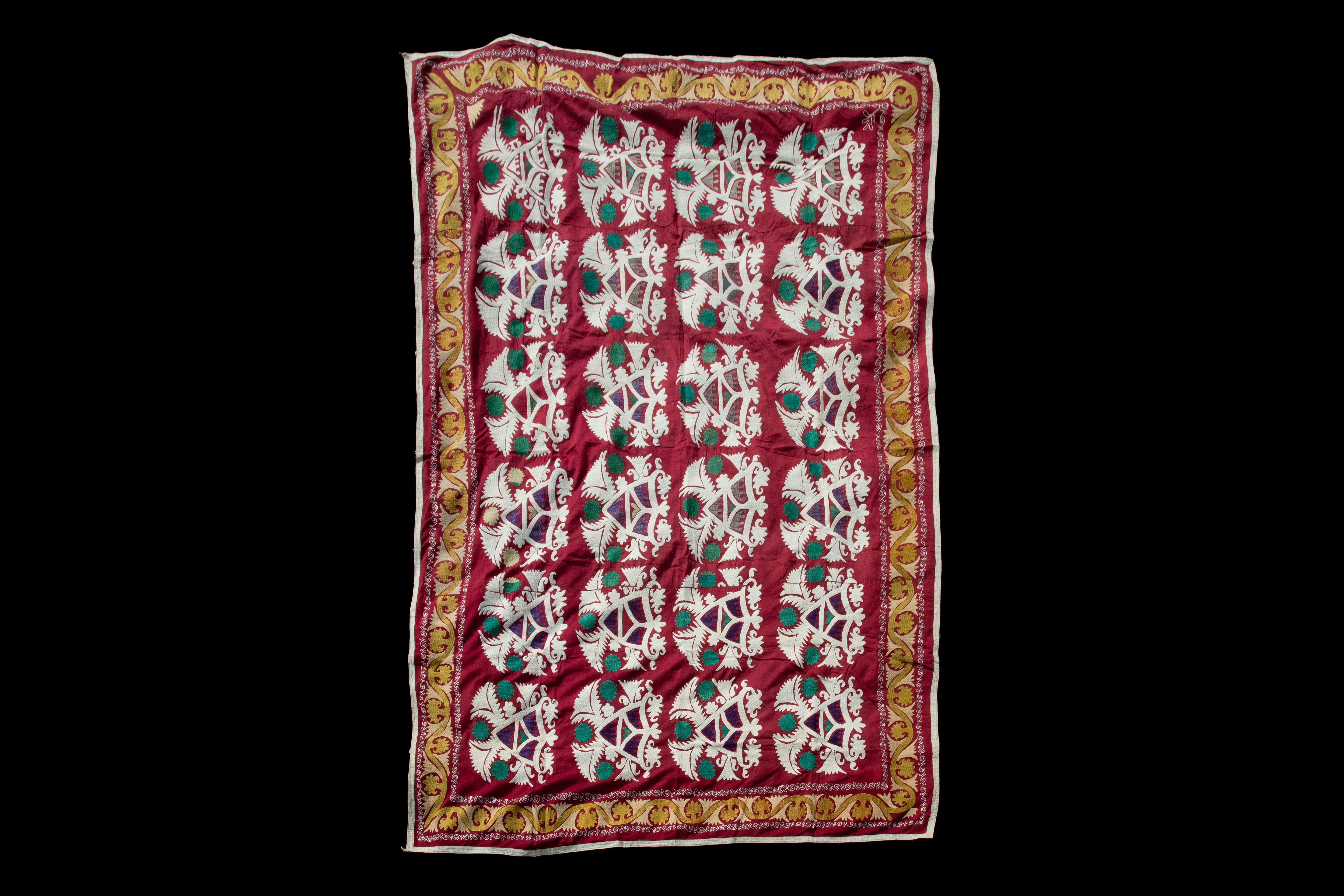 Handmade Vintage Cotton Suzani, Red, White, and Orange

Richly hand-embroidered vintage Uzbek suzani in iconic black and copper oranges.
Sun burst flowers are ringed with black scrolls on natural cotton.
Cotton embroidery in tight stitches give