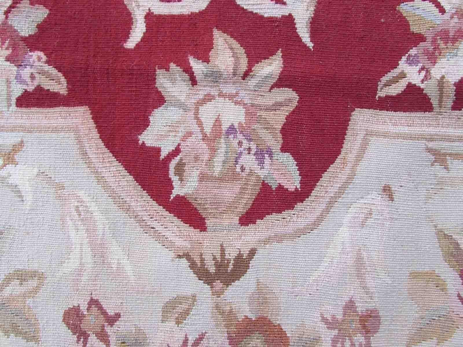 Handmade vintage French Aubusson rug in traditional design and in red and beige colors. The rug is from the end of 20th century in original good condition.

-condition: original good, 

-circa: 1970s,

-size: 2.5' x 4.8' (79cm x