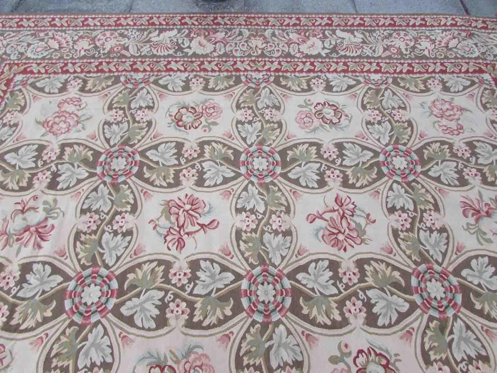 Handmade vintage French Aubusson rug in traditional design. The rug is from the end of 20th century in original good condition.

-condition: original good, 

-circa: 1970s,

-size: 10.1' x 15.5' (310cm x 473cm),

-material: wool,

-country