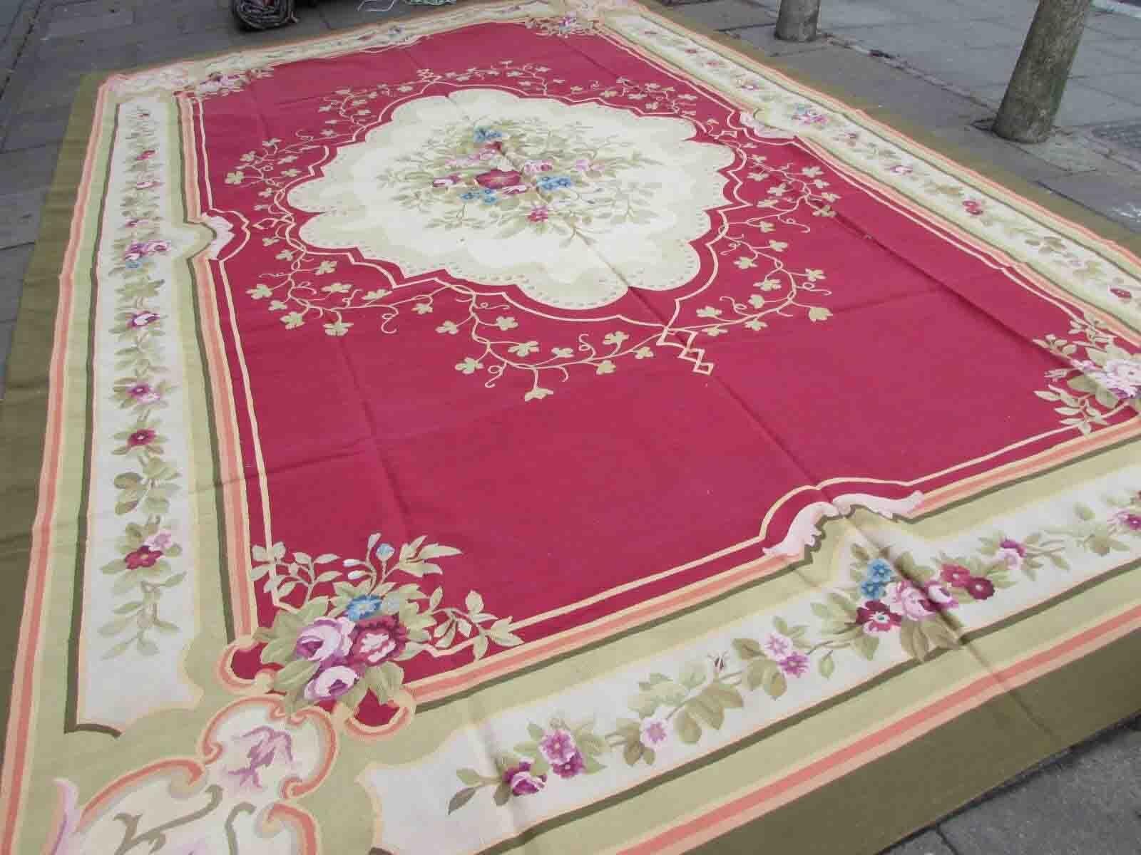 Handmade vintage French Aubusson rug in traditional design and burgundy shades. The rug is from the end of 20th century in original good condition.

-condition: original good, 

-circa: 1970s,

-size: 11.9' x 17.7' (364cm x