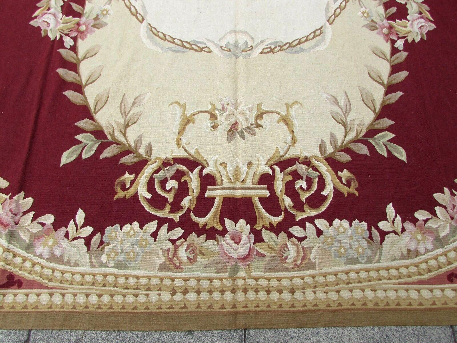 Handmade vintage French Aubusson rug in burgundy and beige wool. This rug has been made in the end of 20th century, it is in original good condition.

- Condition: original good,

- circa 1980s,

- Size: 8.8' x 12.2' (270cm x 373cm),

-