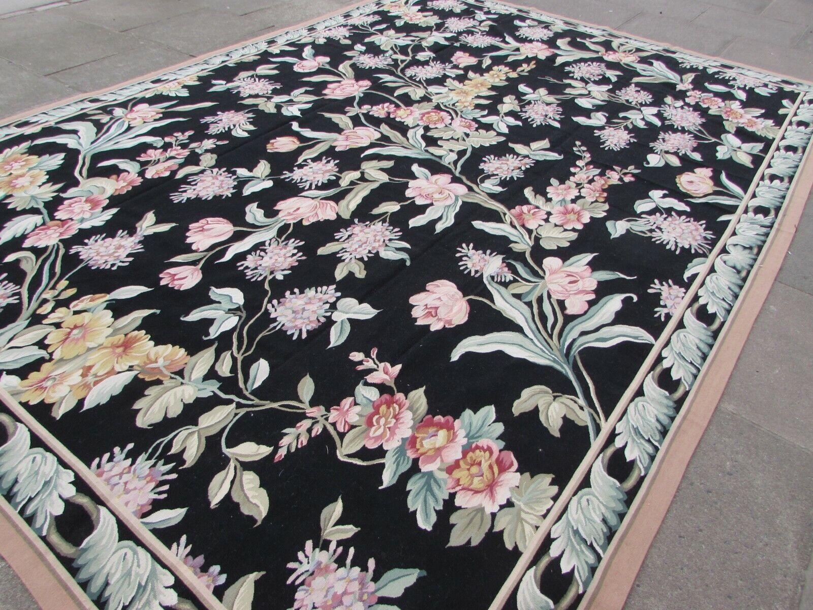 Enhance your living space with the timeless elegance of this Handmade Vintage French Aubusson Rug. This exquisite piece, dating back to the 1970s, showcases the artistry of traditional French design.

Key Features:

Size: Measuring 372 x 270 cm
