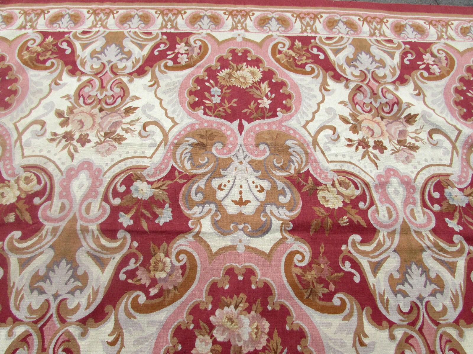This exquisite handmade vintage French Aubusson rug from the 1980s is a true work of art. Measuring 8.9 feet by 12 feet (272cm x 366cm), it features a stunning design that is sure to impress anyone who sees it.

Made from high-quality wool, this rug