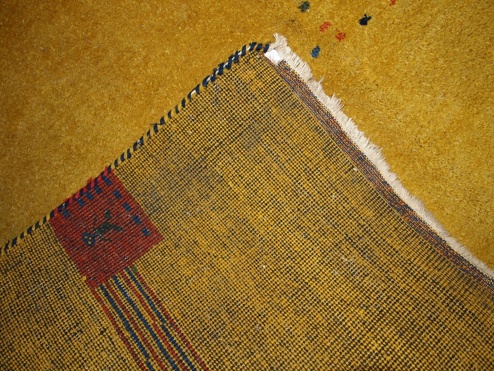 Vintage square Gabbeh rug in bright yellow color. This rug is thick heavy, made in the end of 20th century in wool.

-condition: original good,

-circa: 1970s,

-size: 6.5' x 6.6' (198cm x 201cm),

-material: wool,

-country of origin:
