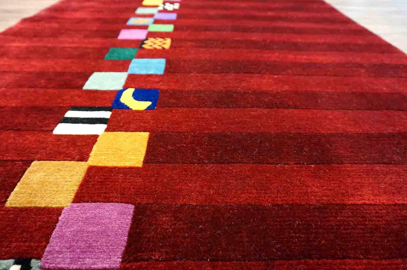 Handmade vintage Gabbeh rug in bright red color and colorful geometric design. The rug is from the end of 20th century in original good condition.

-condition: original good,

-circa: 1970s,

-size: 3.6' x 5.9' (112cm x 182cm),

-material: