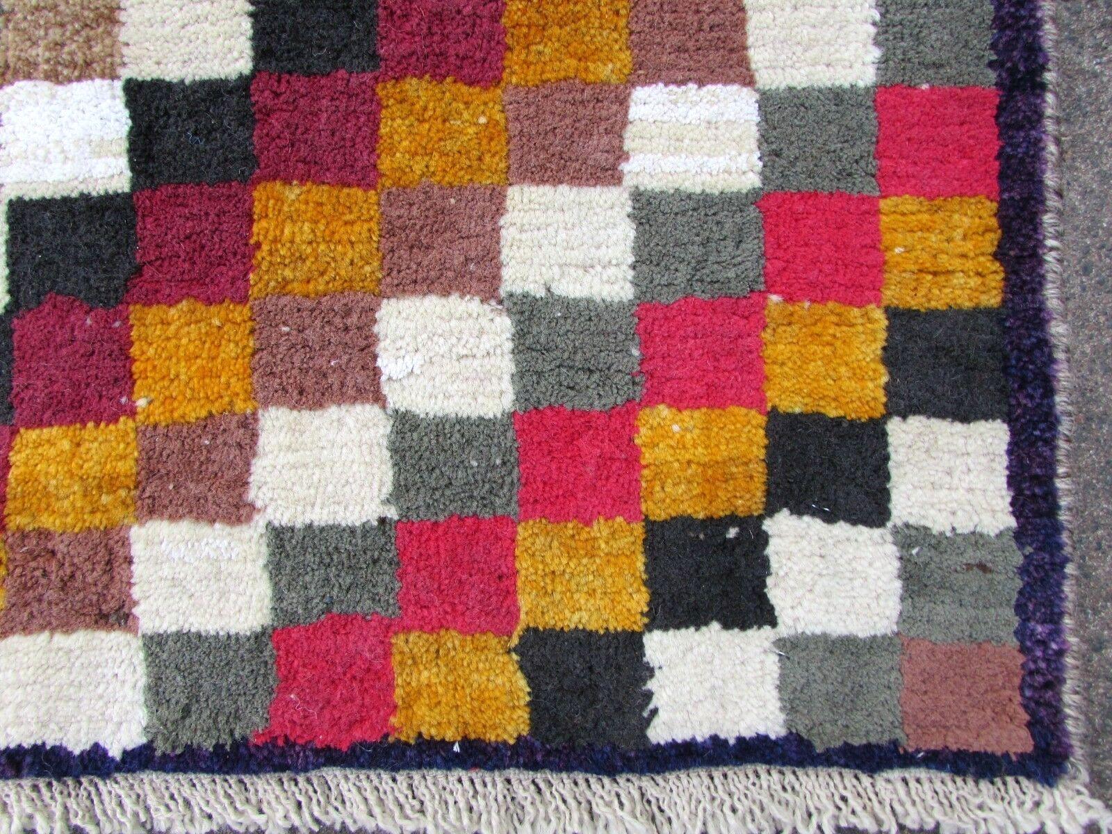 Handmade vintage Gabbeh rug in colorful wool. The rug is from the end of the 20th century in original good condition.

- Condition: original good,

- circa: 1970s,

- Size: 2.7' x 4.4' (83cm x 135cm),

- Material: wool,

- Country of