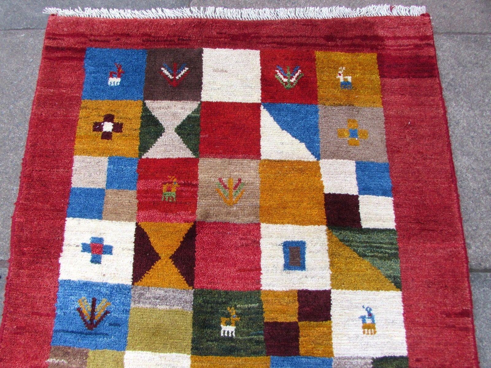 Handmade vintage Gabbeh rug in colorful wool. The rug is from the end of 20th century in original good condition.

- Condition: Original good,

- circa 1970s,

- Size: 3.3' x 4.8' (102cm x 146cm),

- Material: Wool,

- Country of origin:
