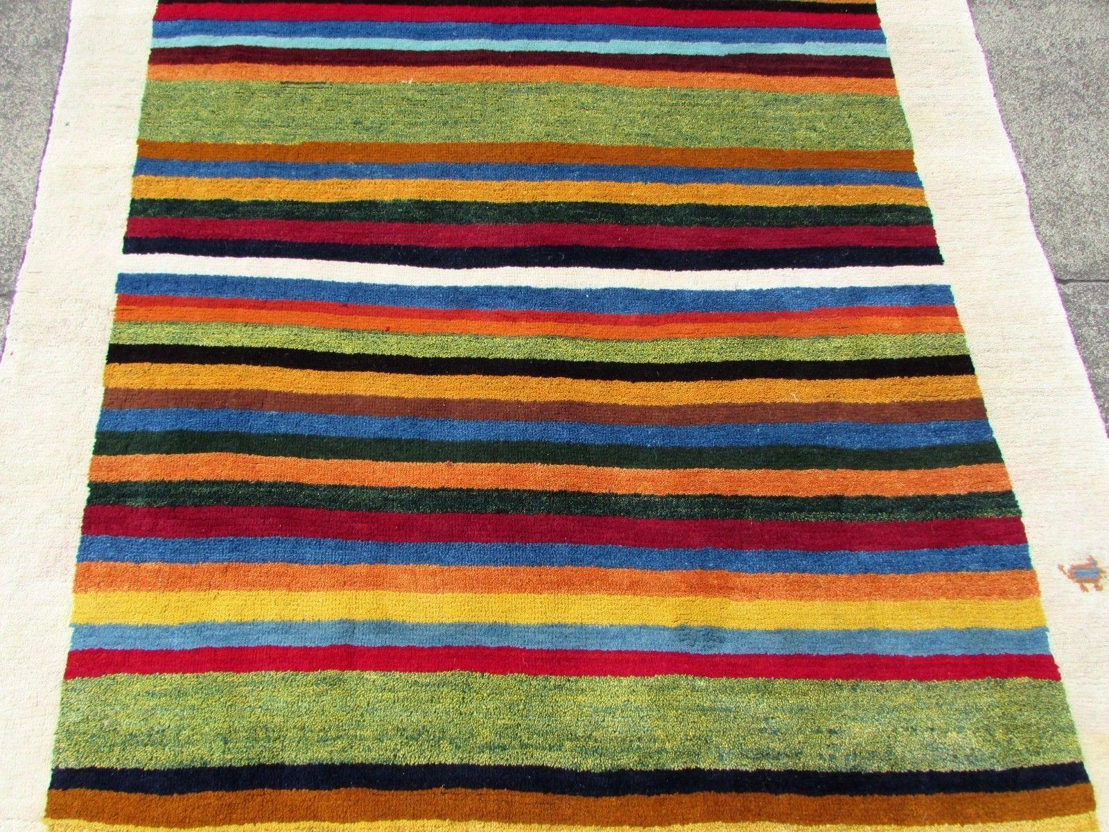Handmade vintage Gabbeh rug in geometric design. The rug is from the end of 20th century in original good condition.

-Condition: Original good,

-circa 1980s,

-Size: 4.7' x 9.7' (138cm x 287cm),

-Material: wool,

-Country of origin:
