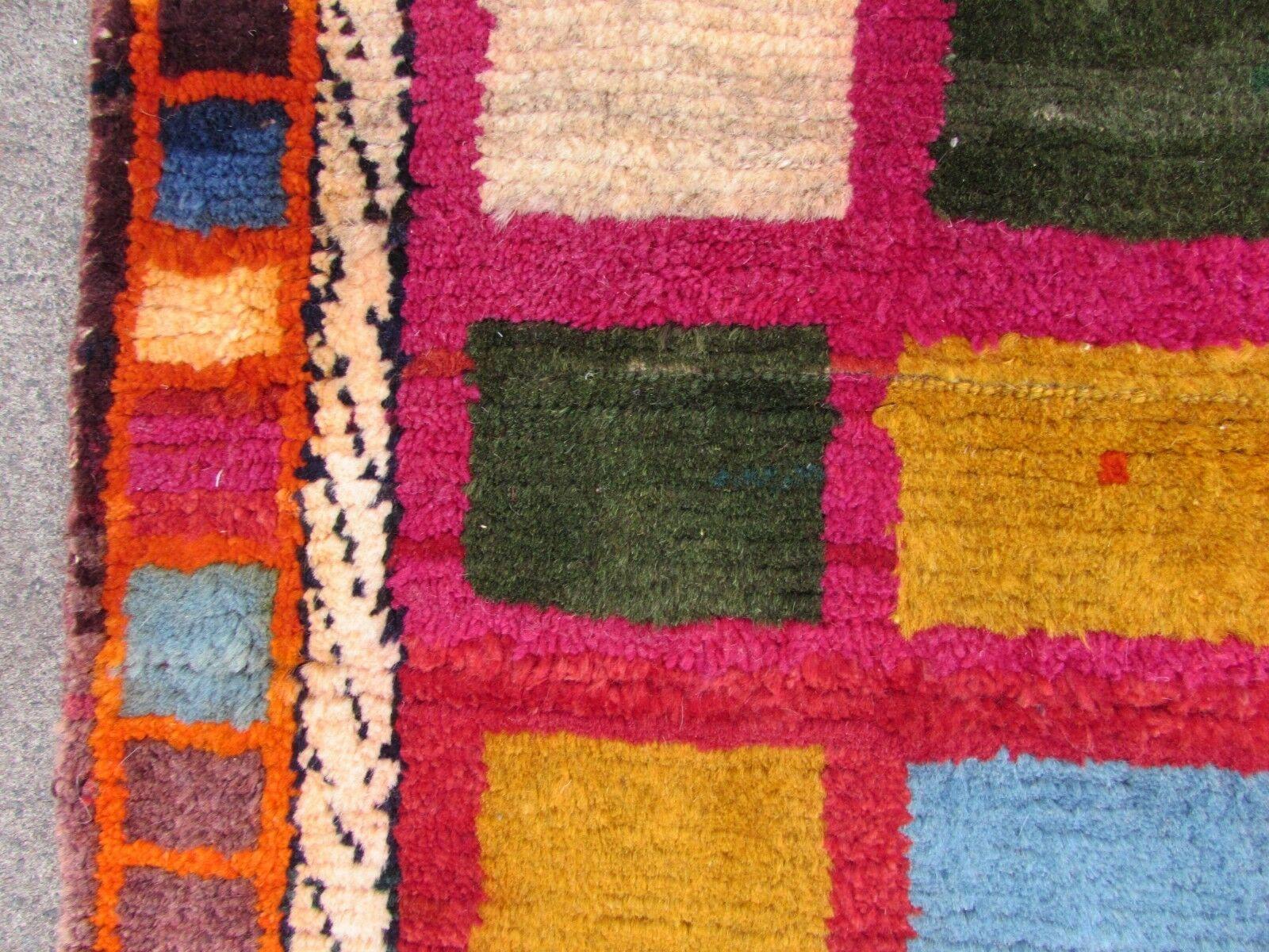 Handmade vintage Gabbeh rug in colorful wool. The rug is from the end of 20th century in original good condition.

-condition: original good,

-circa: 1980s,

-size: 3.6' x 5.7' (110cm x 175cm),

-material: wool,

-country of origin: