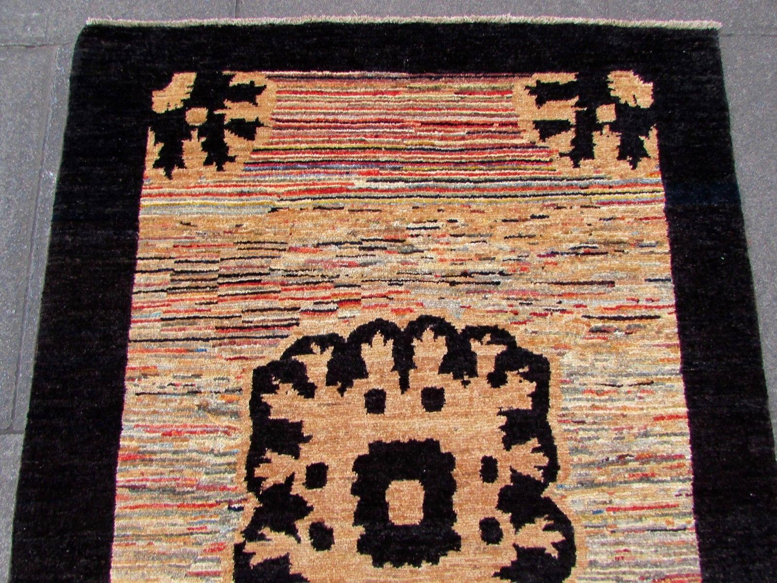 Handmade vintage Gabbeh rug in colorful wool. The rug is from the end of 20th century in original good condition.

- Condition: original good,

- circa 1980s,

- Size: 3.4' x 5' (103cm x 154cm),

- Material: wool,

- Country of origin: