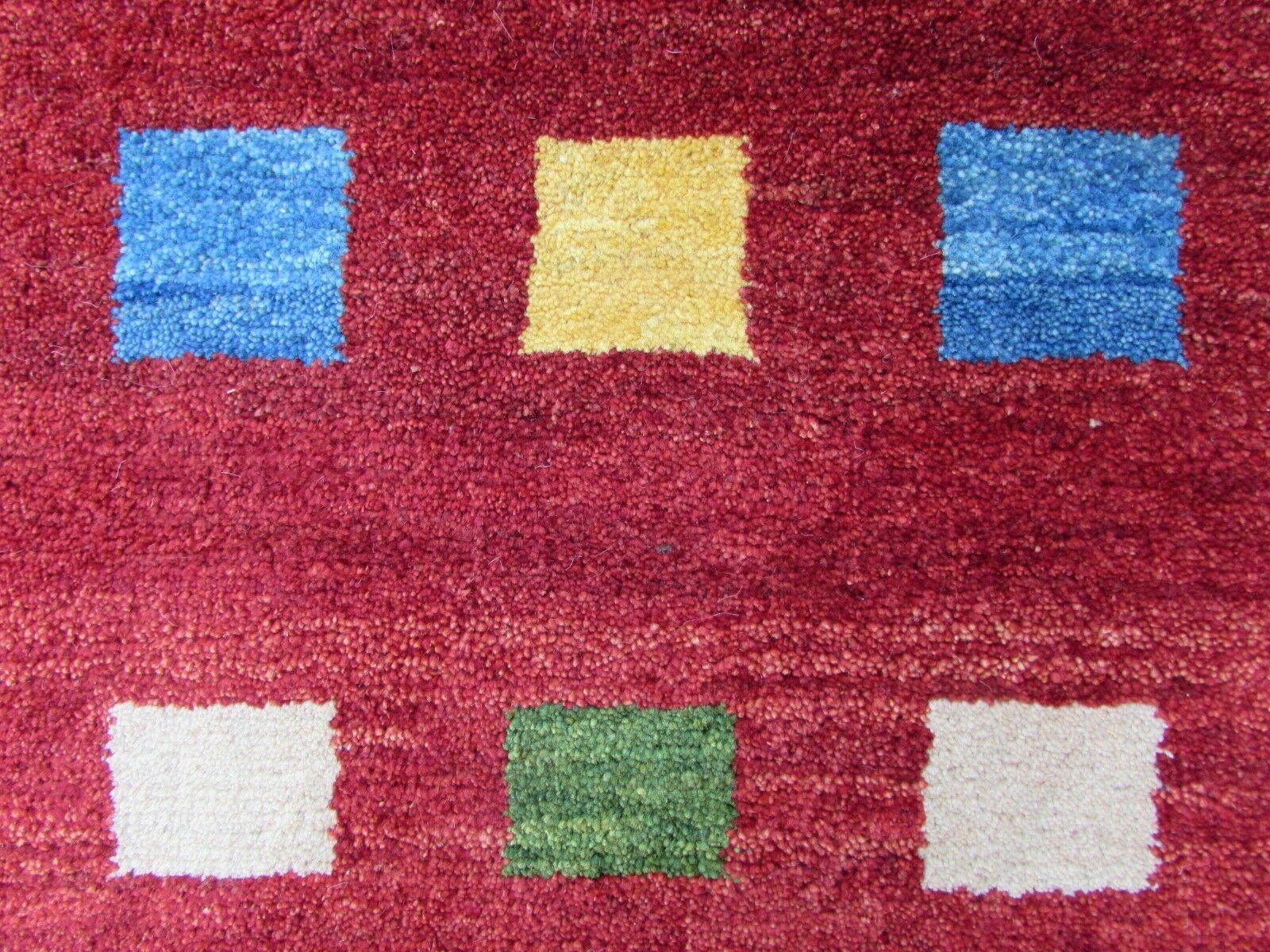 Handmade vintage Gabbeh rug in geometric design. The rug is from the end of 20th century in original good condition.

- Condition: original good,

- circa 1980s,

- Size: 3.5' x 4.9' (106cm x 150cm),

- Material: wool,

- Country of