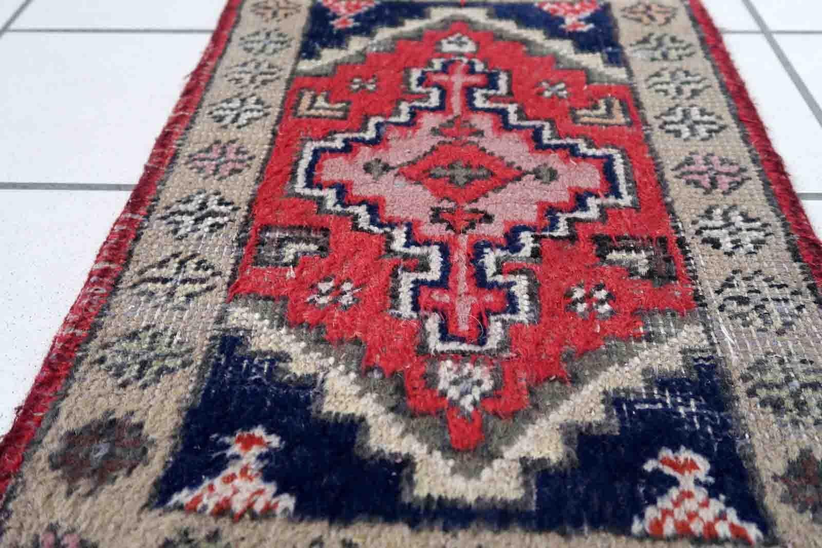 Handmade vintage Middle Eastern rug in traditional medallion design. The rug has been made in wool in the end of 20th century. It is in original condition, has some low pile.

-condition: original, some low pile,

-circa: 1970s,

-size: 1.2' x