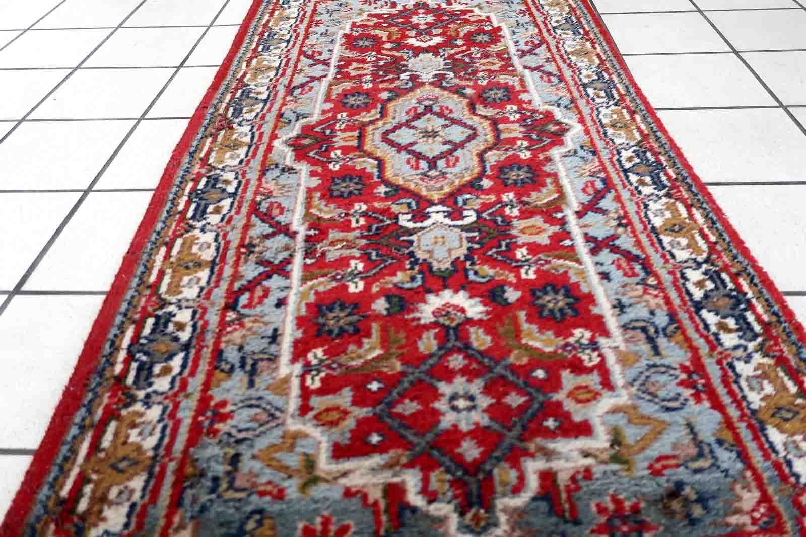 Handmade vintage Persian Hamadan rug with medallion design. The rug is in original condition from the end of 20th century, it has some signs of age.

-condition: original, some signs of age,

-circa: 1970s,

-size: 2.2' x 4.7' (70cm x