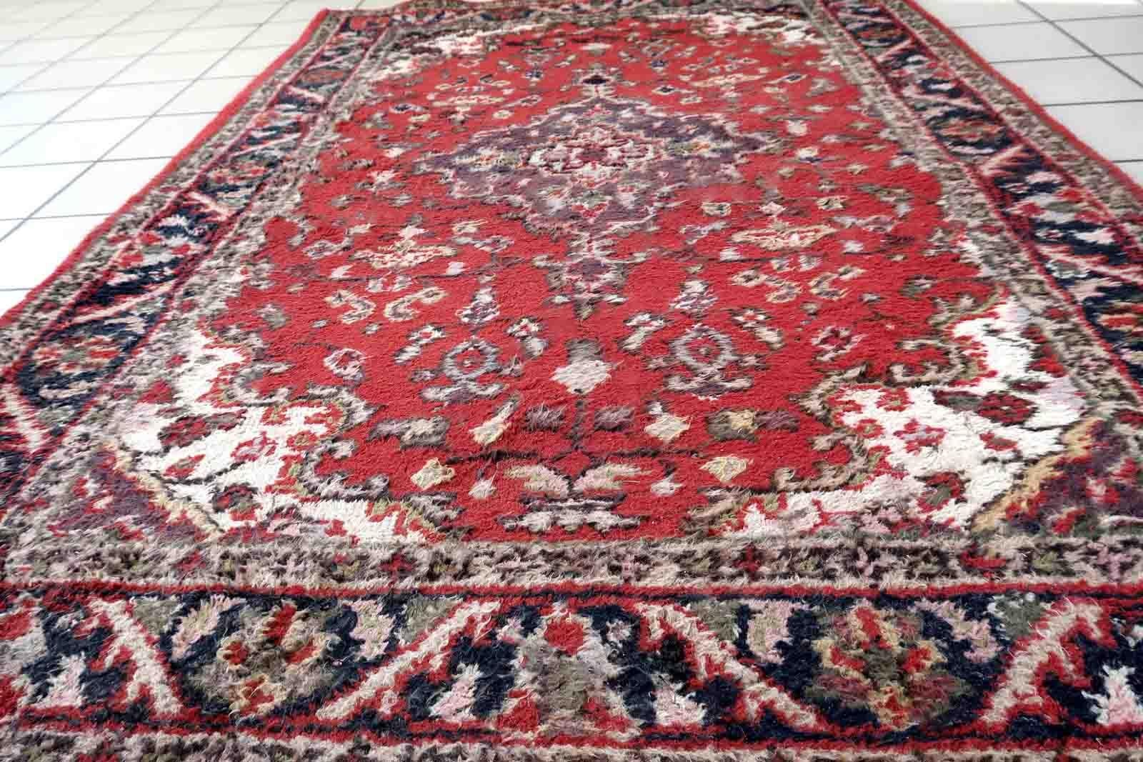 Handmade vintage Hamadan rug in red and blue colors. The rug is from the end of 20th century in original good condition.

-condition: original good,

-circa: 1970s,

-size: 4.1' x 6' (125cm x 183cm),

-material: wool,

-country of origin: