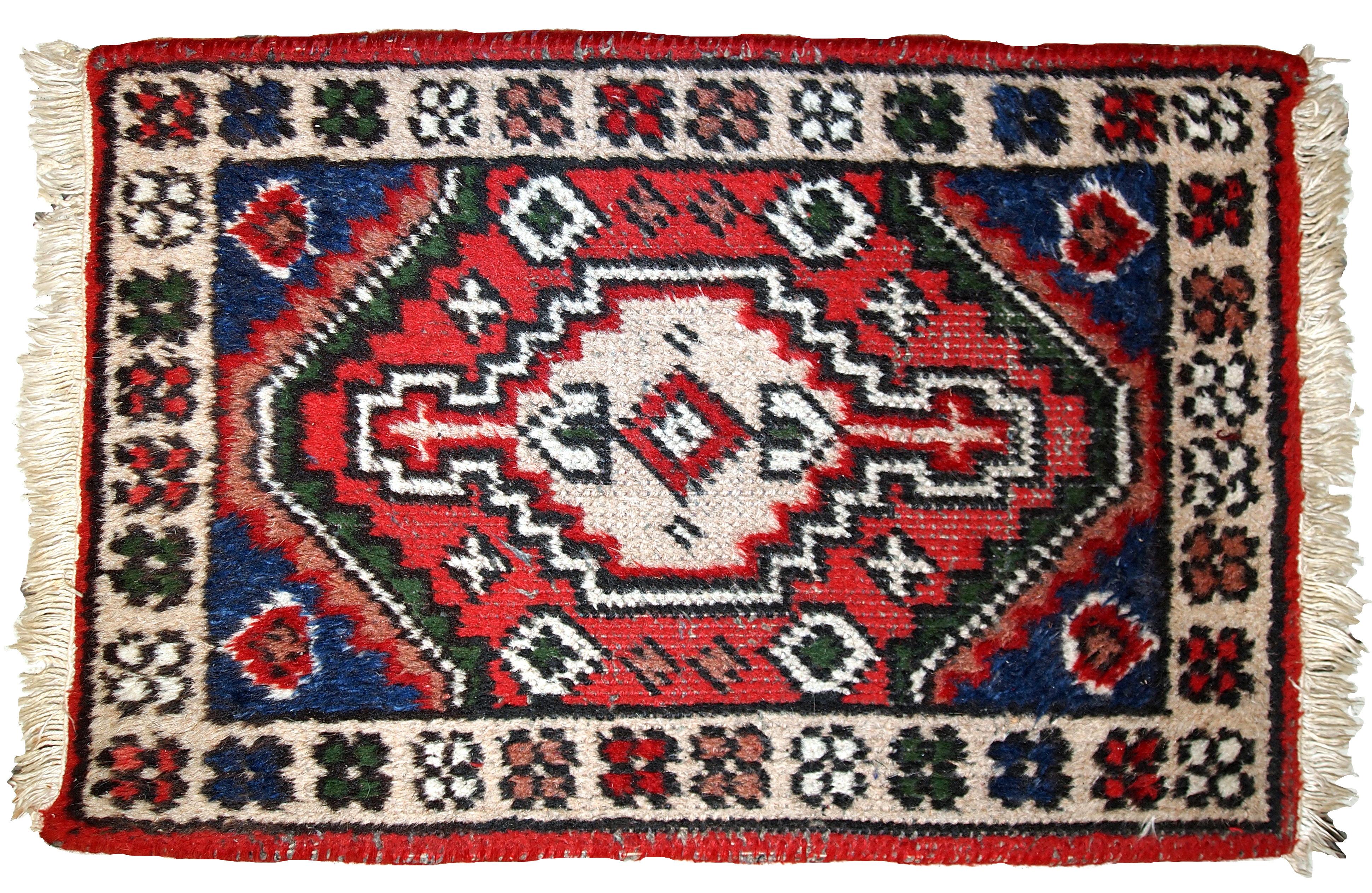 Vintage handmade Hamadan style mat from the end of 20th century. It is in original condition, some low pile.

- Condition: original, some low pile,

- circa 1970s,

- Size: 1.3' x 1.9' (40cm x 59cm),

- Material: wool,

- Country of