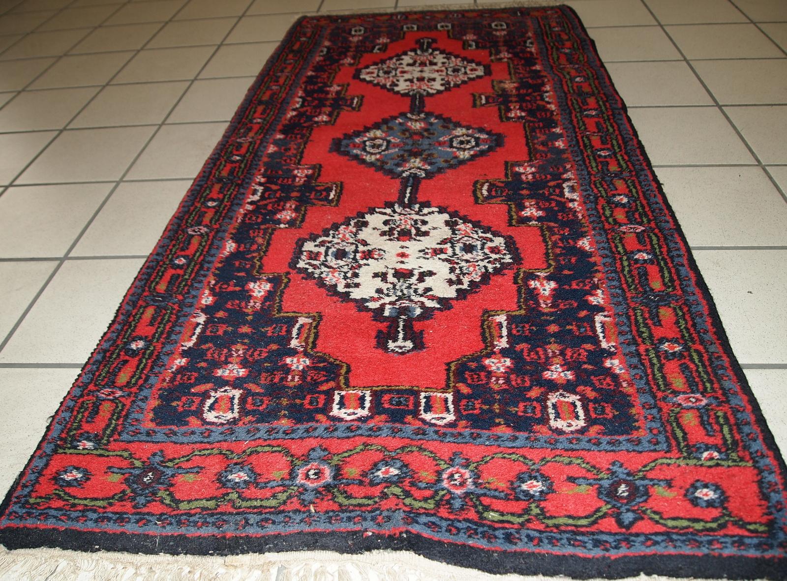 Handmade vintage Hamadan style rug in bright red color. The rug is in original good condition from the end of 20th century.

?-Condition: original good,

-circa 1970s,

-Size: 2.2' x 4.5' (69cm x 136cm),

-Material: wool,

-Country of