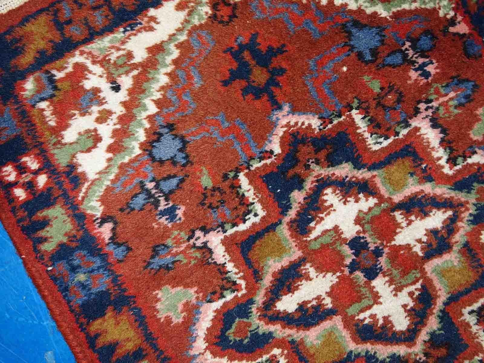 Vintage handmade Middle Eastern Hamadan mat in original good condition. The rug is from the end of 20th century in brick red colour.

-condition: original good,
?
-circa: 1970s,

-size: 1.6' x 2.3' (50cm x 70cm),

-material: