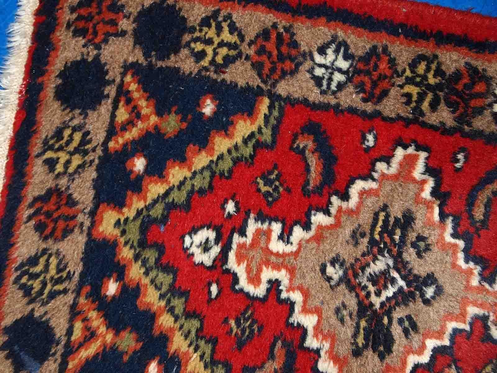 Vintage handmade Middle Eastern mat in original good condition. The rug is from the end of 20th century.

-condition: original good, 

-circa: 1970s,

-size: 1.4' x 1.9' (42cm x 60cm),

-material: wool,

-country of origin: Middle