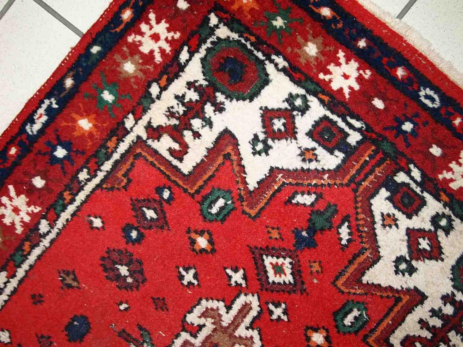 Handmade vintage Middle Eastern rug in traditional design. The rug is from the end of 20th century in original good condition. 

-condition: original good,

-circa: 1970s,

-size: 2.4' x 4.4' (75cm x 136cm),
?
-material: wool,

-country of