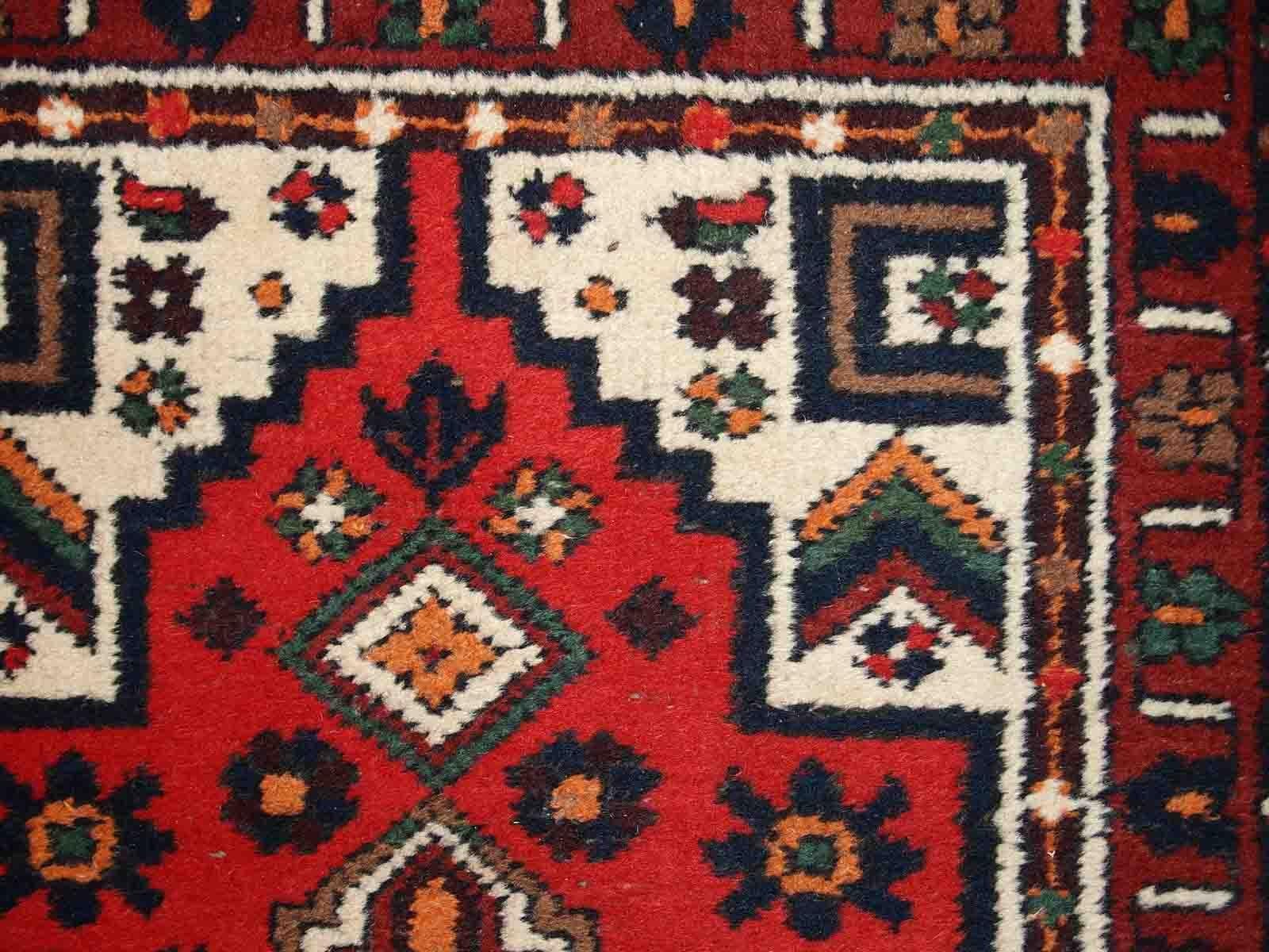 Handmade vintage Middle Eastern rug in traditional design. The rug is from the end of 20th century in original good condition. 

-condition: original good,

-circa: 1970s,

-size: 2.4' x 4.5' (74cm x 140cm),
?
-material: wool,

-country of