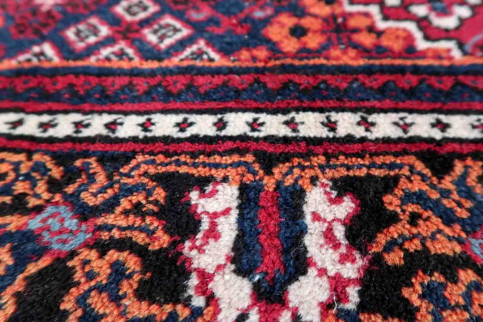 Handmade vintage Persian Hamadan rug in traditional design. The rug is from the end of 20th century, it is in original good condition. 

-condition: original good,

-circa: 1970s,

-size: 4.4' x 6.7' (136cm x 205cm),

-material:
