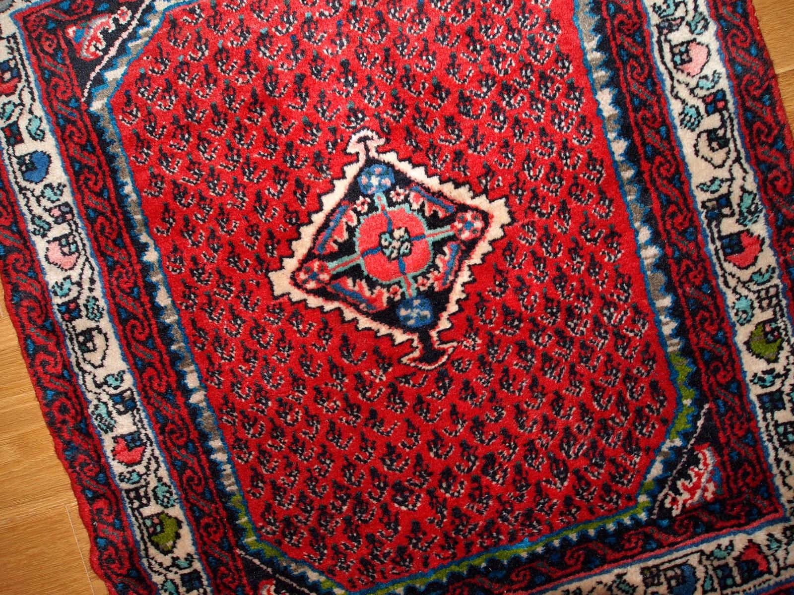 Vintage almost square Hamadan rug. In original good condition in red color with bright decorative accents on it. White border with tribal ornaments.

 