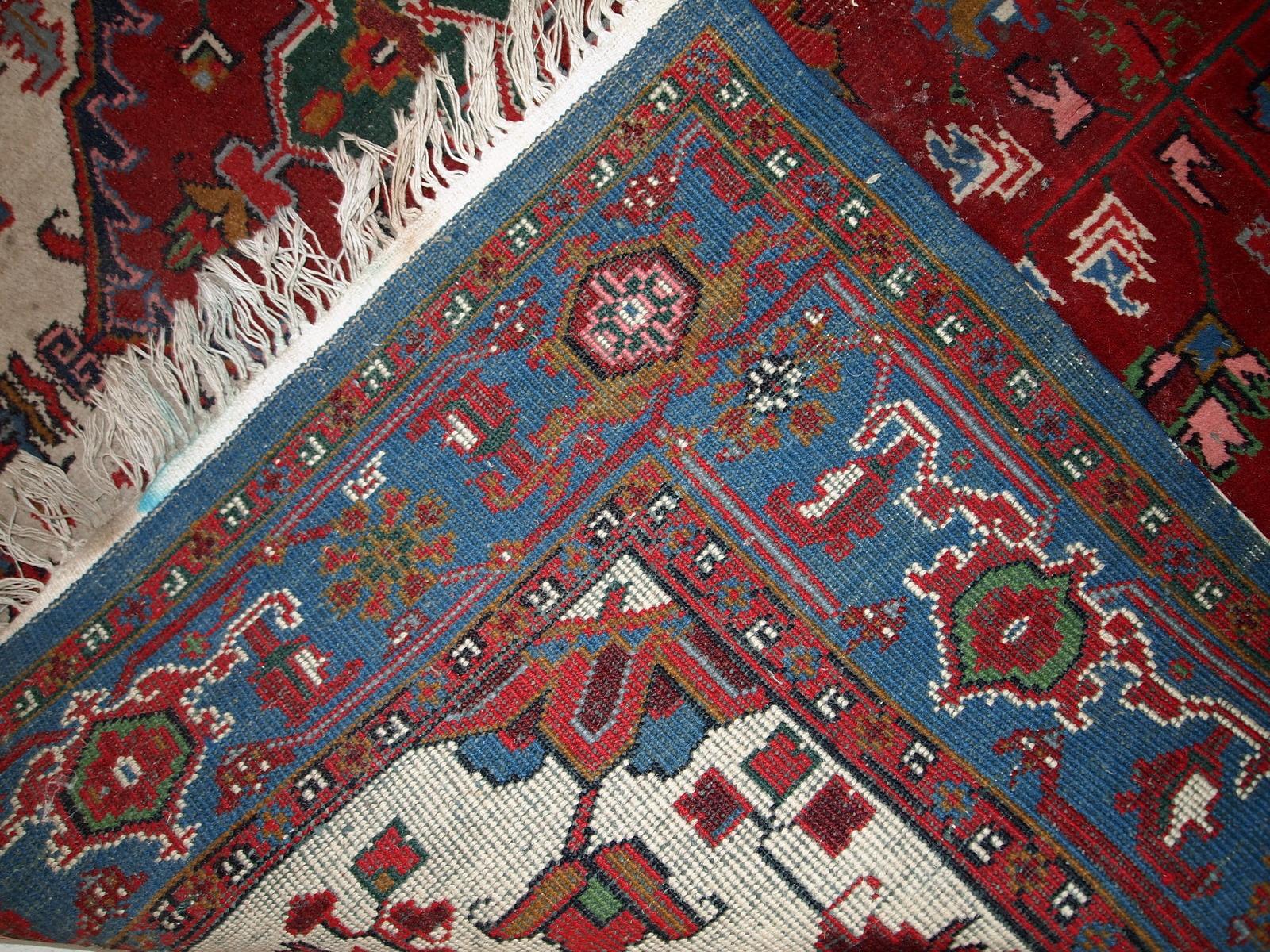 Handmade vintage Heriz rug in original condition, it has some low pile. The rug is from the middle of 20th century made in wool.

- Condition: Original, some low pile,

- circa 1960s,

- Size: 6.6' x 9.8' (202cm x 298cm),

- Material: