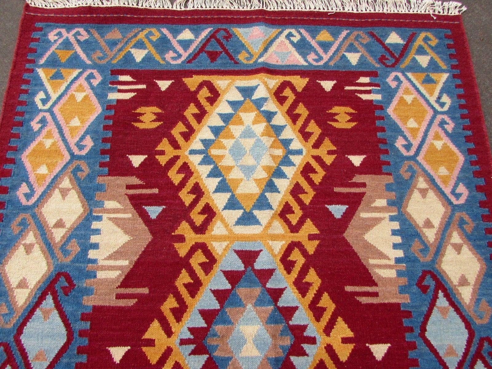 Handmade vintage Indian Dhurri kilim in colourful shades. It has been made in the end of 20th century in cotton.

-Condition: Original good,

-circa 1970s,

-Size: 4.8' x 6.4' (141cm x 189cm),

-Material: Cotton,

-Country of origin: