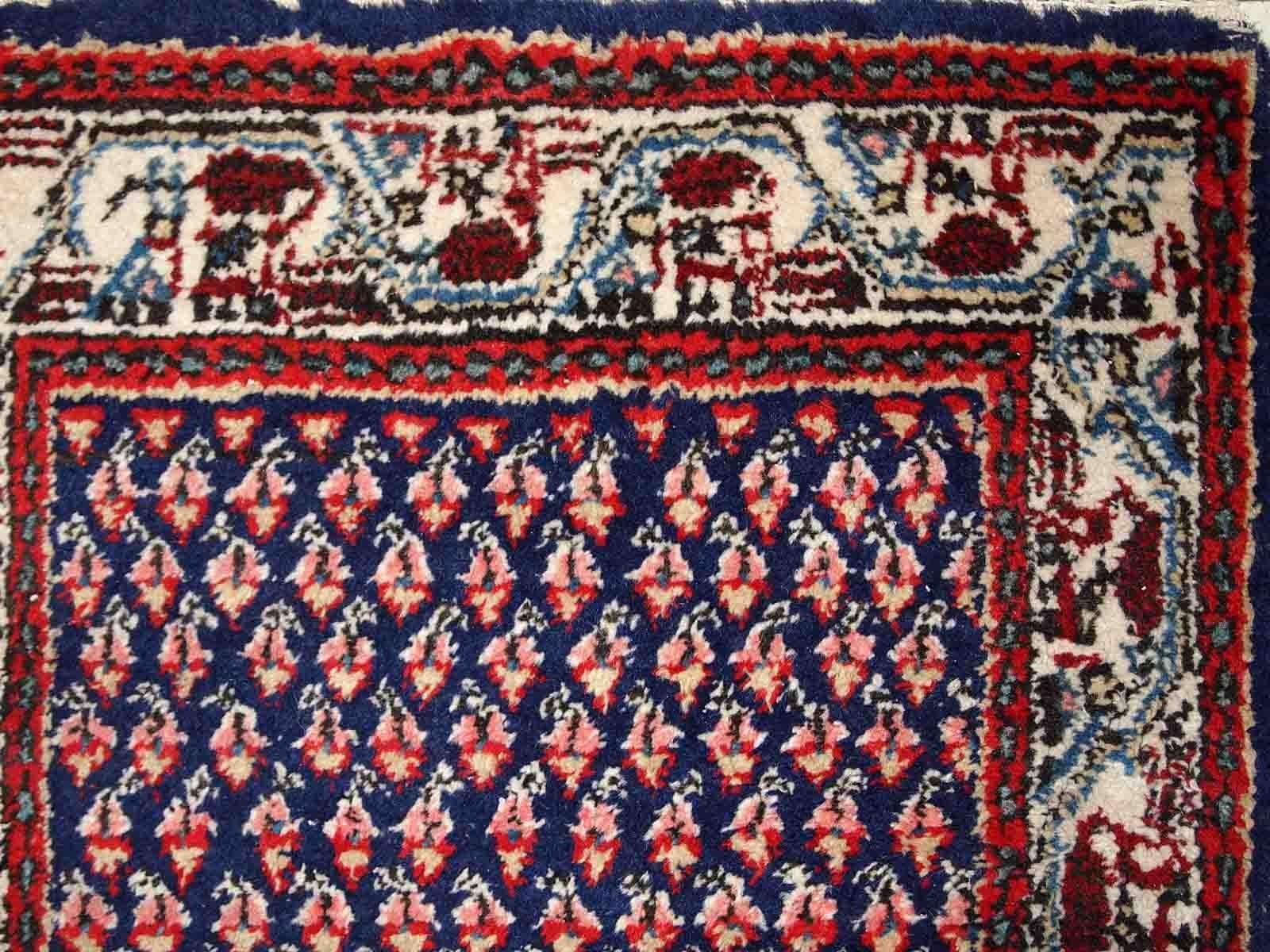 Handmade vintage Indian rug with Middle Eastern Seraband design. The rug is made in the end of 20th century, it is in original good condition.

-condition: origial good, 

-circa: 1970s,

-size: 2' x 4' (62cm x 124cm),
?
-material: