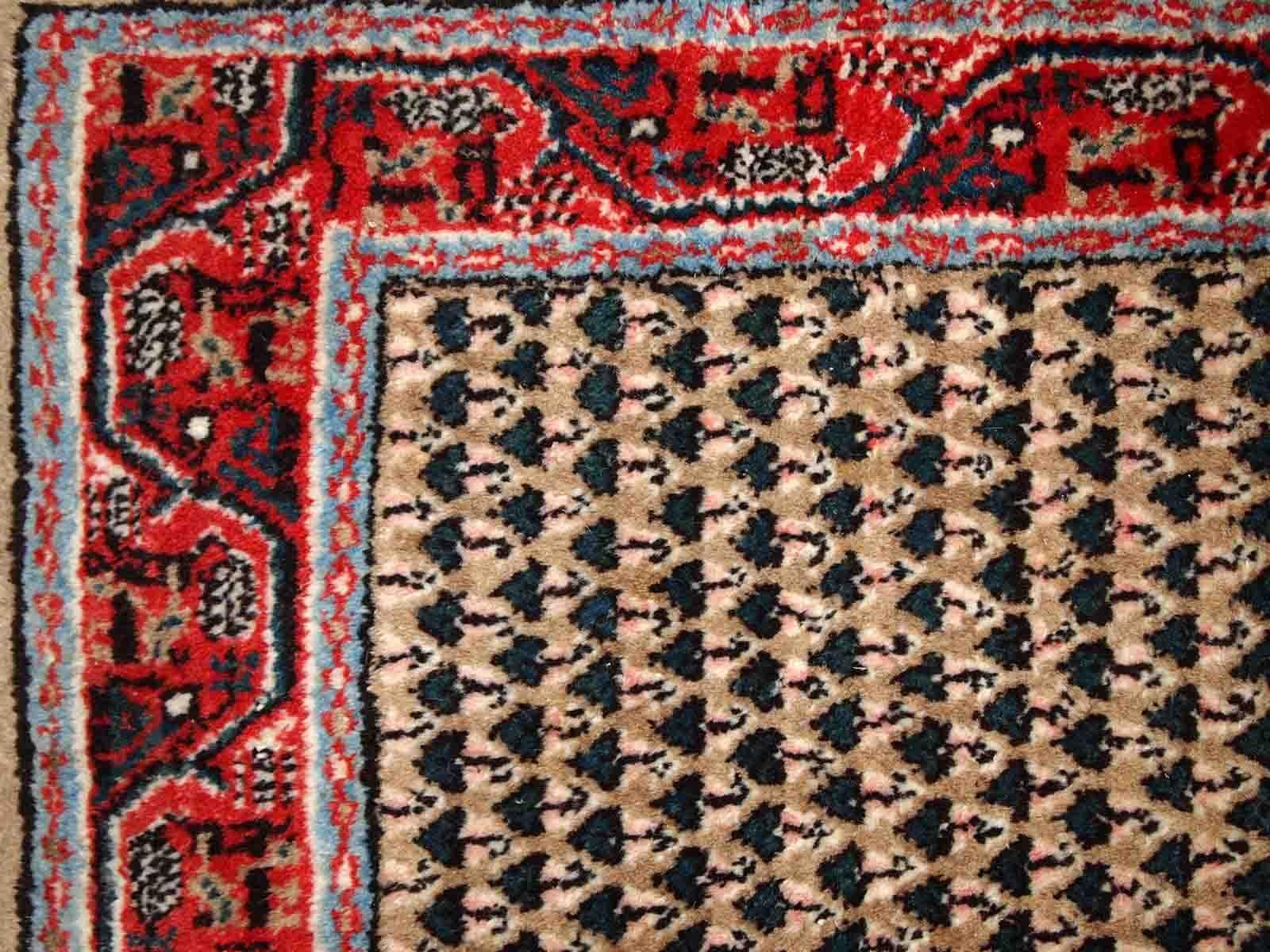 Handmade vintage Indian rug with Middle Eastern Seraband design. The rug is made in the end of 20th century, it is in original good condition.

-condition: origial good, 

-circa: 1970s,

-size: 2.1' x 4.1' (65cm x 125cm),
?
-material: