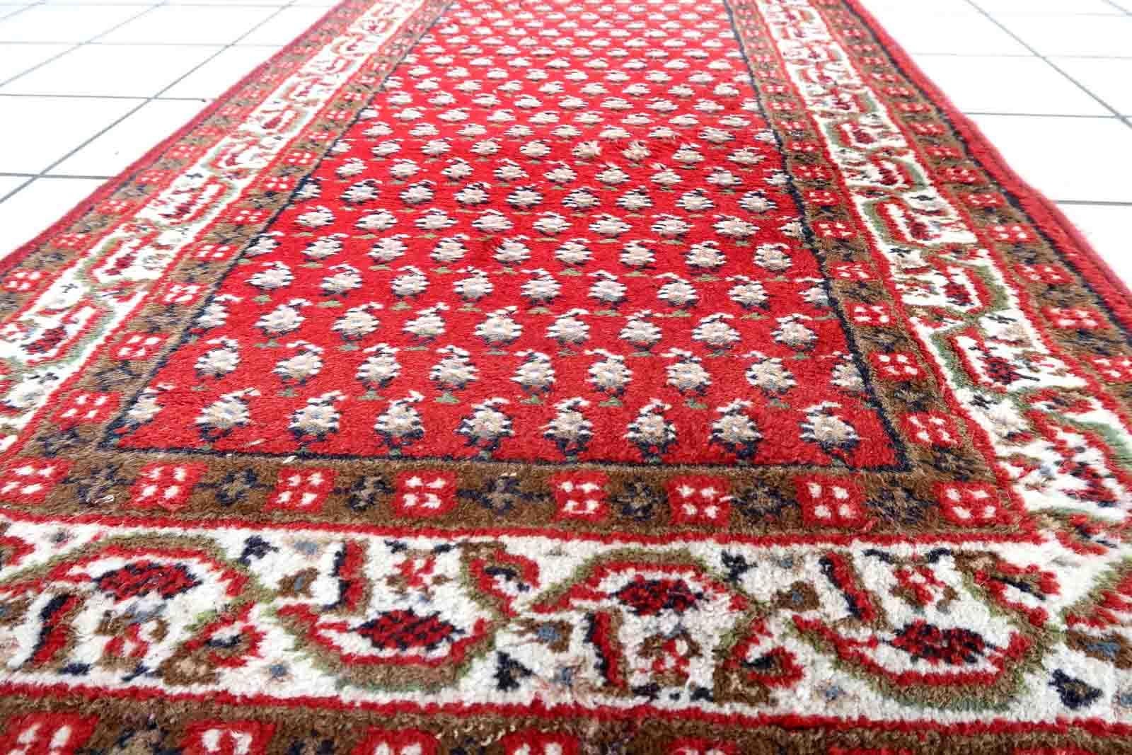 Handmade vintage Indian Seraband rug in red color and all-over design. The rug has been made in the end of 20th century. It is in good condition, has some signs of age.

-condition: good,

-circa: 1970s,

-size: 2.4' x 4.5' (74cm x