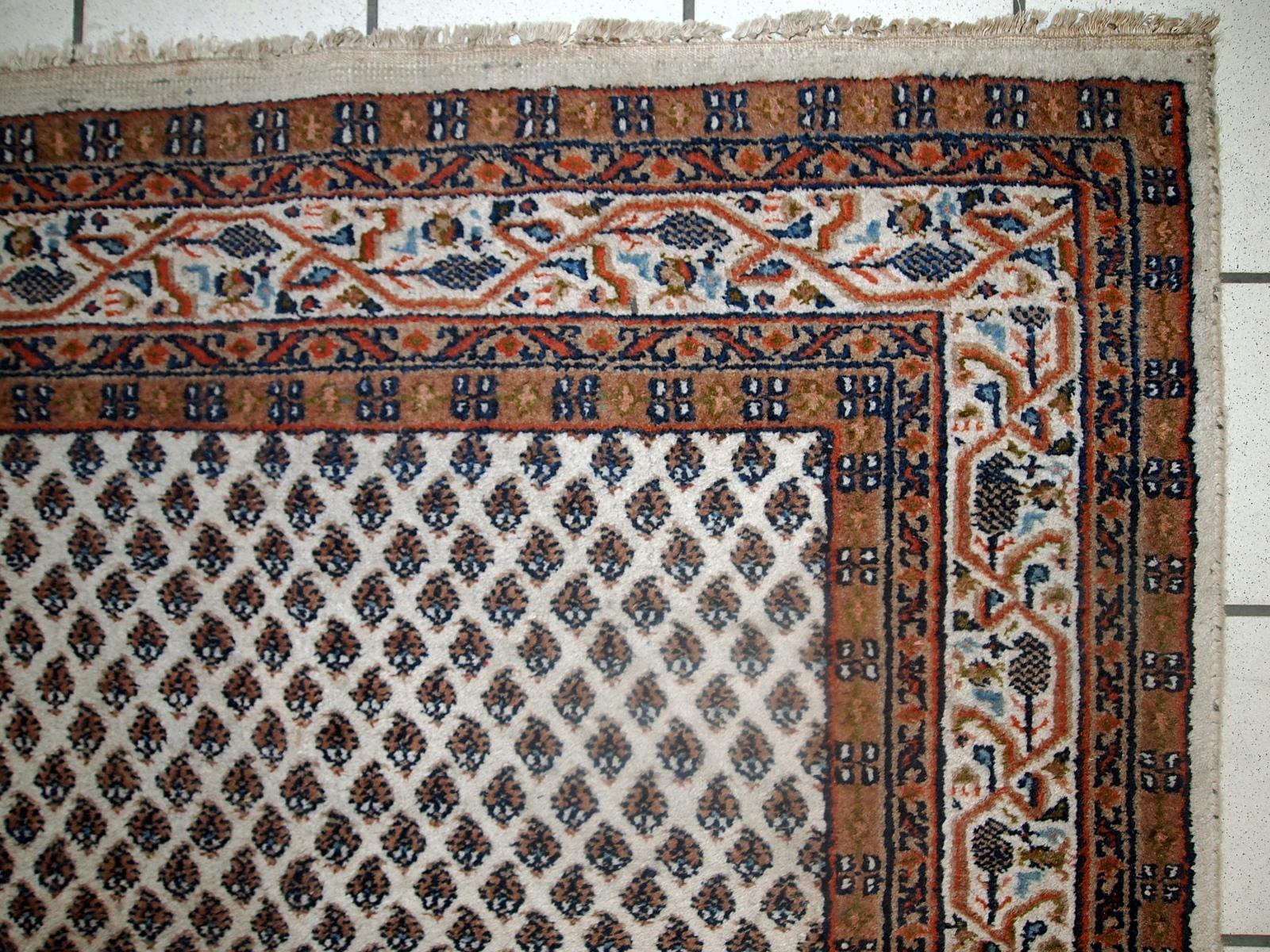 Handmade vintage Seraband carpet from India, made in the end of 20th century. The rug is in original good condition.

-condition: original good,

-circa: 1980s,

-size: 4' x 6' (124cm x 185cm),

-material: wool,

-country of origin: