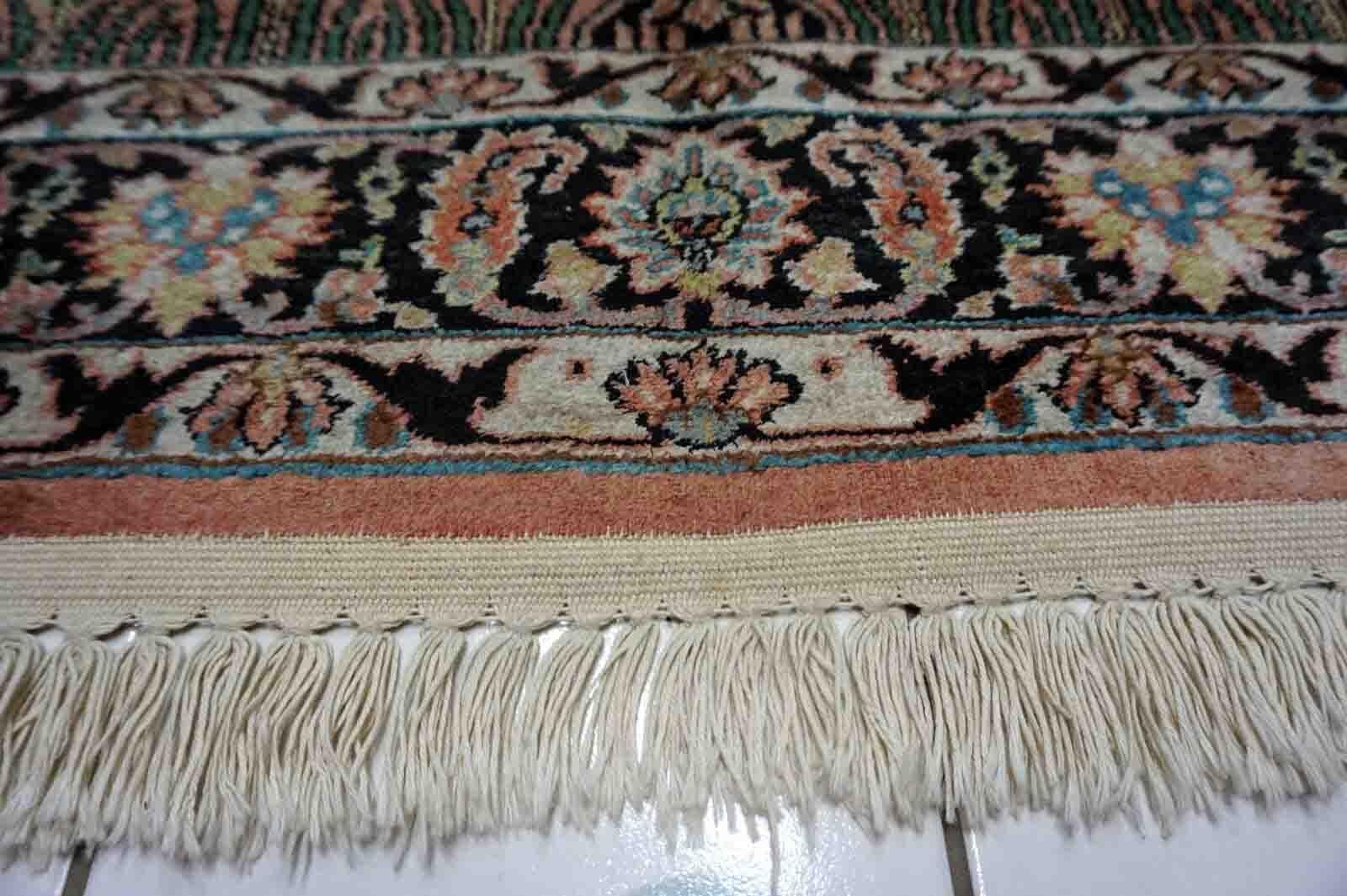 Introducing our Handmade Vintage Indian Kashmir Silk rug, a stunning addition to any home decor. Crafted with precision and care, this rug is a true work of art, featuring intricate patterns and vibrant colors that will breathe new life into any
