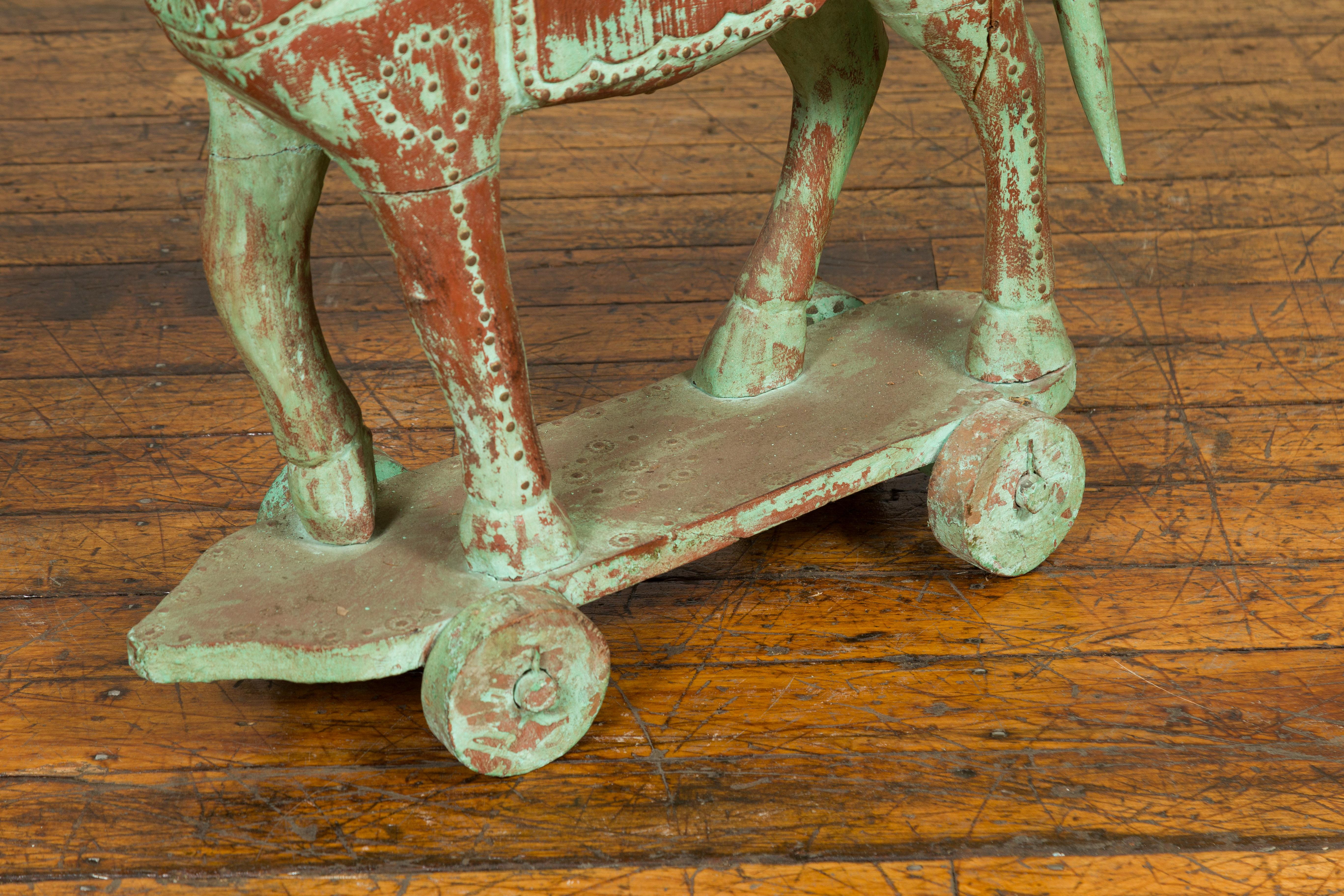 antique wooden horse on wheels