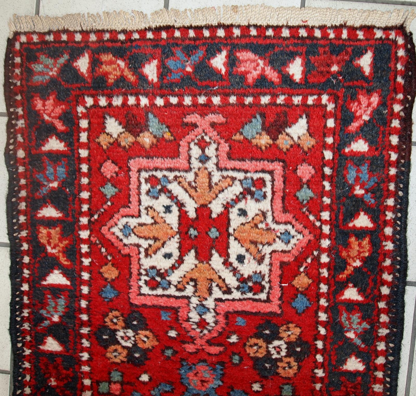 Handmade vintage Karajeh narrow runner in original good condition. The rug is from the middle of the 20th century made in wool.

- Condition: original good,

- circa 1960s,

- Size: 1.9' x 10.2' (57cm x 313cm),

- Material: wool,

-