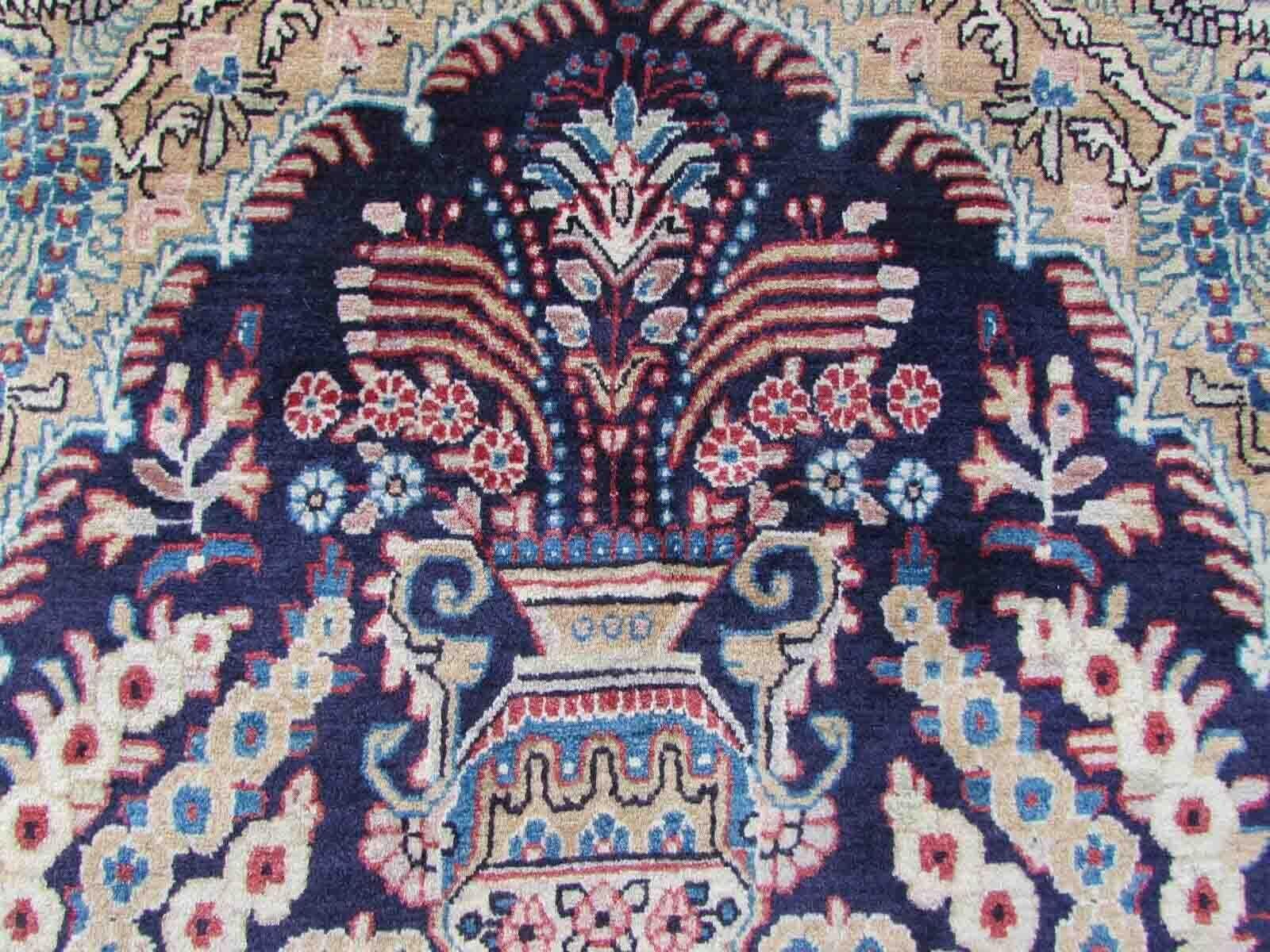 Handmade vintage Kashan rug in prayer design with birds and flowers. The rug is from the end of 20th century in original good condition.

-condition: original good, 

-circa: 1970s,

-size: 4' x 6.8' (124cm x 209cm),

-material: