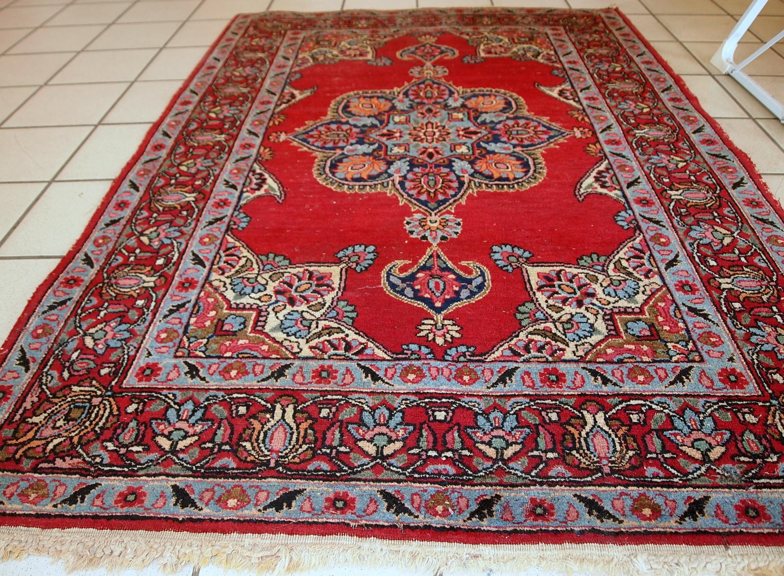 Vintage Kazvin style rug in bright red color. The rug is from the end of 20th century. It is in original condition, has some low pile.

- Condition: original, some low pile,

- circa 1970s,

- Size: 3.3' x 4.7' (100cm x 144cm),

- Material: