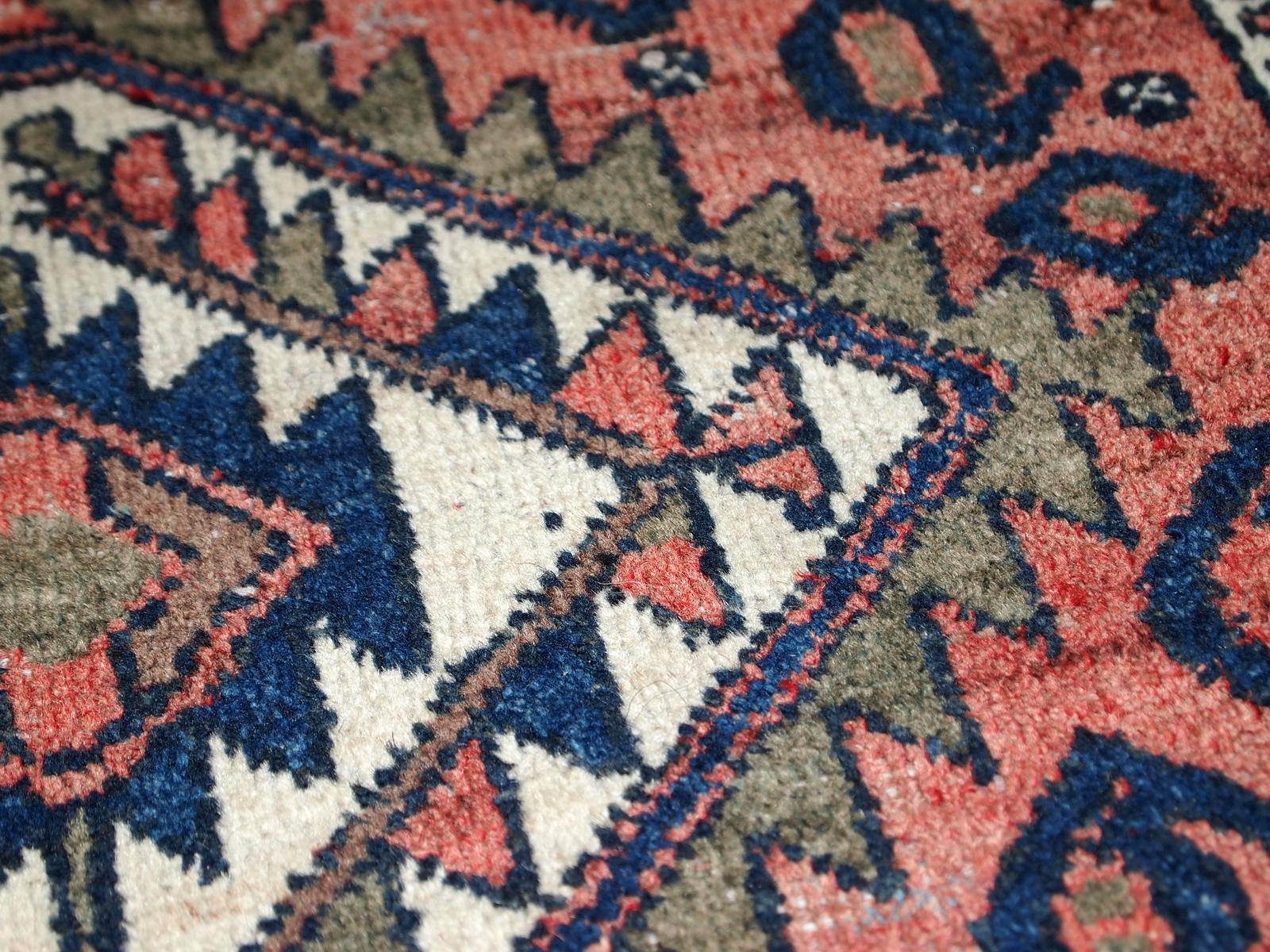 Handmade vintage Kurdish bagface in original condition, it has some signs of age. The rug is from the beginning of 20th century.

?-Condition: original, some low pile, 

-circa 1930s,

-Size: 1.8' x 1.9' (55cm x 59cm),

-Material: