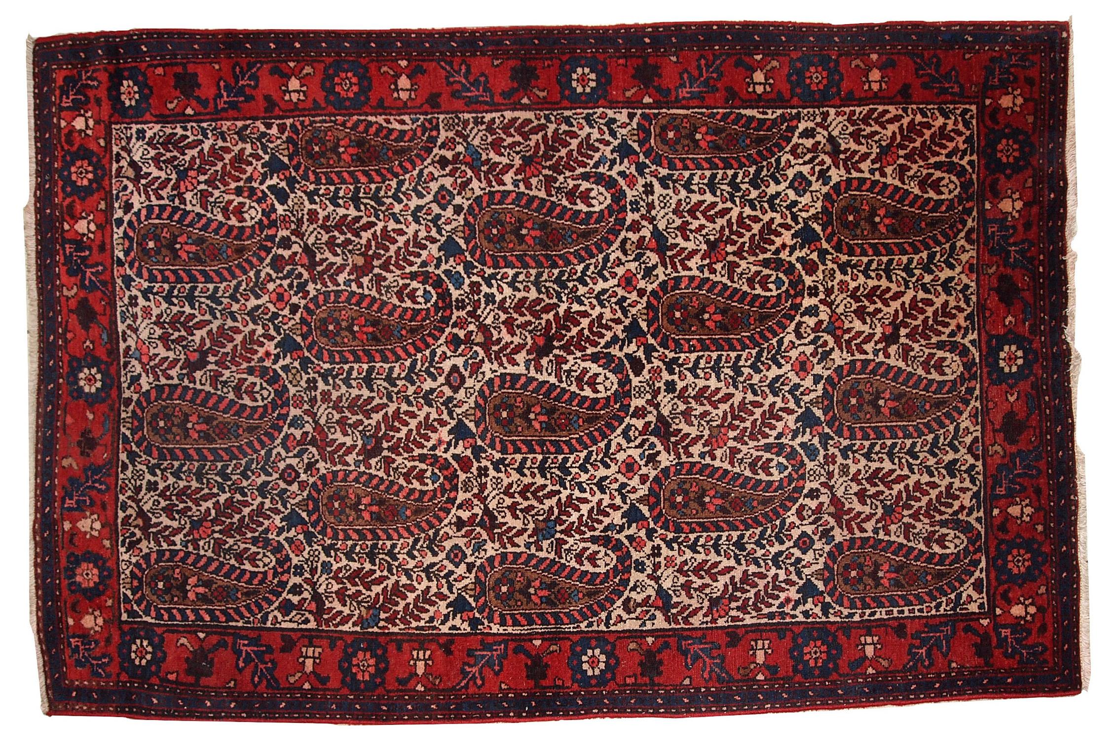 Handmade semi-antique Malayer style rug in original condition with some colour run. The rug made in traditional Payslei design. 

 