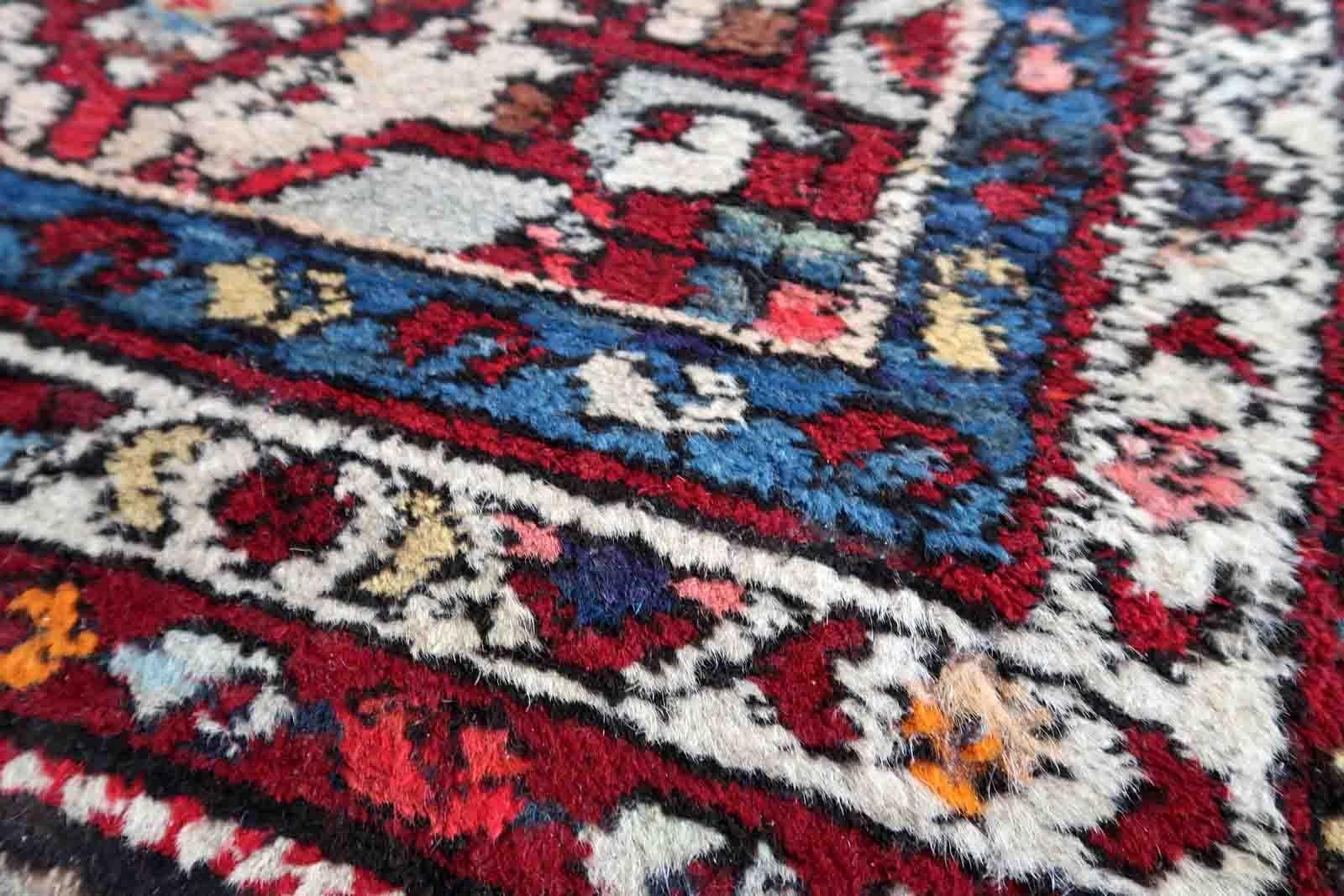 Handmade vintage Malayer rug in red color. The rug has been made in wool in the middle of 20th century. It is in original condition, it has some signs of age.

-condition: original, some signs of age,

-circa: 1970s,

-size: 2.5' x 4.9' (78cm