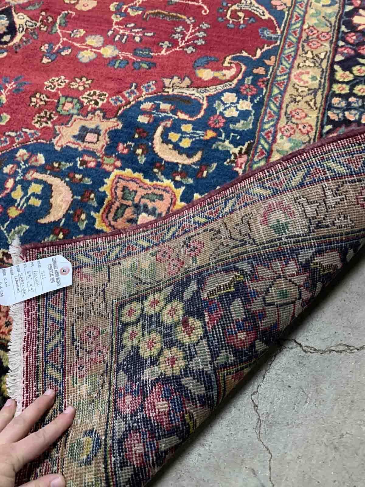 Handmade vintage Middle Eastern rug in traditional design. The rug is from the middle of 20th century in original good condition.

-condition: original good,

-circa: 1950s,

-size: 6.5' x 9.9' (198cm x 302cm),
?
-material: wool,

-country